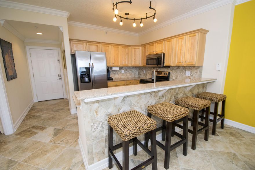 GULF FRONT 2bed/2ba 15th floor unit at Tropic Winds fully furnished, NEVER RENTED and in pristine condition! This FULLY FURNISHED condo greets you with Gulf views as soon as you step in the door & features tile floor throughout, GRANITE countertops & STAINLESS steel appliances in the kitchen, pantry, owners' closets, guest room w/ en suite bath, breakfast bar seating for 4, walk-in laundry room, GULF FRONT MASTER BEDROOM, and OVERSIZED BALCONY extending the length of the unit! It's a short drive to enjoy upscale dining and shopping on Hwy 30A and activities for the whole family at Pier Park. If you prefer to stay home, you can relax on your Gulf front balcony and enjoy the stunning Florida sunsets! Tropic Winds features over 330ft. of pristine Gulf front paradise, indoor/outdoor pool, hot tub, sauna & steam rooms, fitness center, assigned covered parking, and outdoor grilling area overlooking the Gulf! INVESTORS - this incredible Gulf front unit is offered turn-key ready for vacation rentals -  start your investment today and reap the benefits of the busy spring/summer rental seasons!