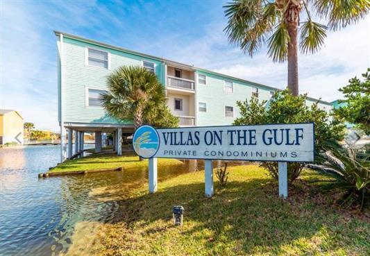 BEST VALUE ON THE BEACH! Lowest priced 2 bedroom condo on the south side of Via Deluna! Looking for the perfect beach retreat or investment property? Located at Villas on the Gulf, this 2 bedroom, 1.5 bathroom offers a wonderful location with deeded beach access, community pool and clubhouse. Fresh paint throughout, recently remodeled (no popcorn ceilings) and brand new sliding glass door. You'll also enjoy the 1 car carport assigned to this unit as well as ample closet space with pocket doors. The kitchen and bathrooms have been updated and also have tile in all the wet areas. Laundry facility located on property. Relax on a quiet evening on your balcony listening to the waves crash onto the beach while enjoying a cold beverage.
