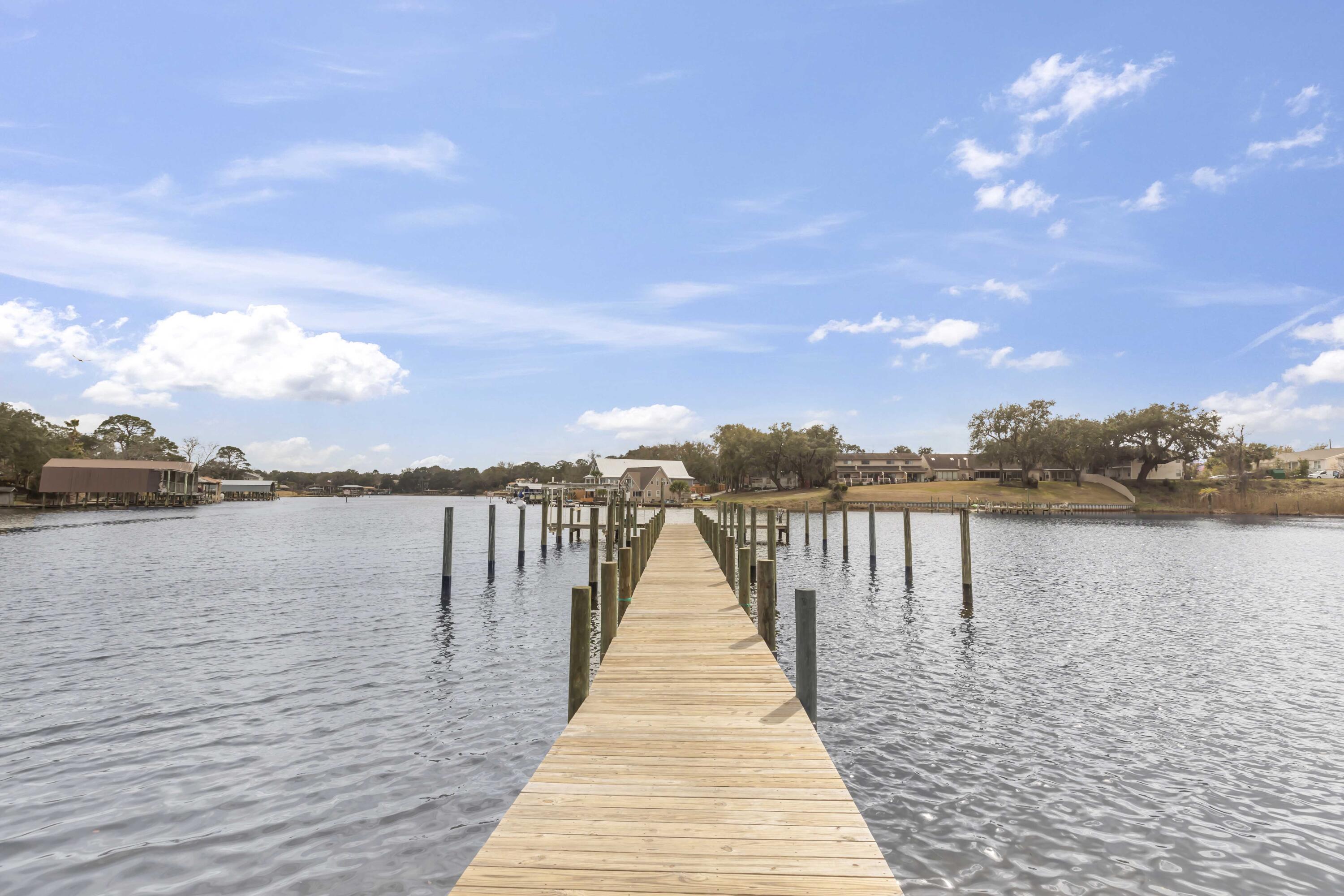 Price reduced and ready to SELL! Welcome to Pier 1 Condominiums - a waterfront community in the heart of Fort Walton Beach. This 3bd/2ba unit is totally move-in ready. There is tile throughout so no need to hassle with old carpet. The upgraded kitchen has stainless steel appliances and granite countertops. There's also space for a dining table and a private balcony. Enjoy peace of mind with upgraded storm windows and a metal storm door with code lock. The electrical panel has also been updated and has copper wiring. The water heater was replaced in 2021 and the HVAC is 2018 and includes a UV-C light air quality system. Both bathrooms have been updated within the past several years. In addition to the tasteful interior, this complex comes loaded with amenities. Enjoy access to a pool overlooking the bayou, tennis court, community dock, and grilling area. Boating enthusiasts will delight in the community's boat slips and direct access to Cinco Bayou, just a short trip away from Choctawhatchee Bay. Plus, with HOA fees covering water, trash, pest control, and grounds maintenance, worry-free living is yours to enjoy.
Centrally located in Fort Walton Beach, Pier 1 provides quick access to Sam's Club, Walmart, Lowes, tons of dining options, medical care, plus Okaloosa Island with Fishing Pier and Boardwalk on the beach. Both Eglin AFB and Hurlburt Field AFB are around 15 minutes away, which could make for an easy commute. Whether you're seeking a permanent residence or an investment opportunity, this condo is worth checking out. Schedule your showing today.