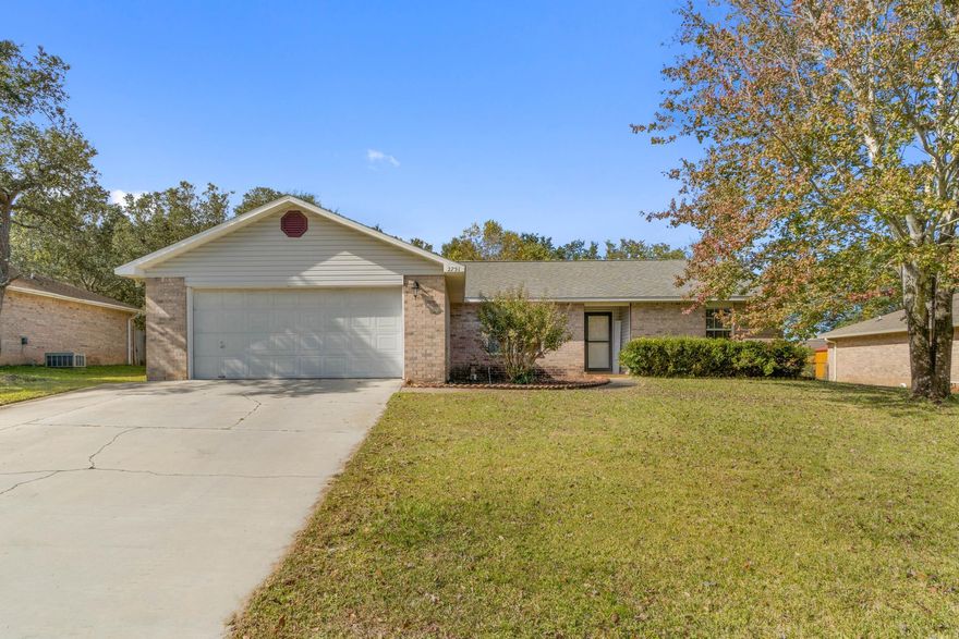 Welcome home to this lovely all brick Navarre retreat on a spacious 0.33 acre lot featuring 3 bedroom and 2 bathrooms with an additional dining room space AND a large screened in patio! Conveniently located off of East Bay Blvd on a street with NO HOA pull into the driveway and you'll immediately love the extended driveway pad for additional parking. Walk into the front door and you'll see this charming home features hard surface flooring throughout with no carpet! The well appointed kitchen has all the space you're looking for with an additional pantry and an eat in kitchen area. The master bedroom leads to the en suite where you'll find double vanities and two separate walk in closets! The other two guest bedrooms have ample closet space and share a bathroom between them. You will LOVE