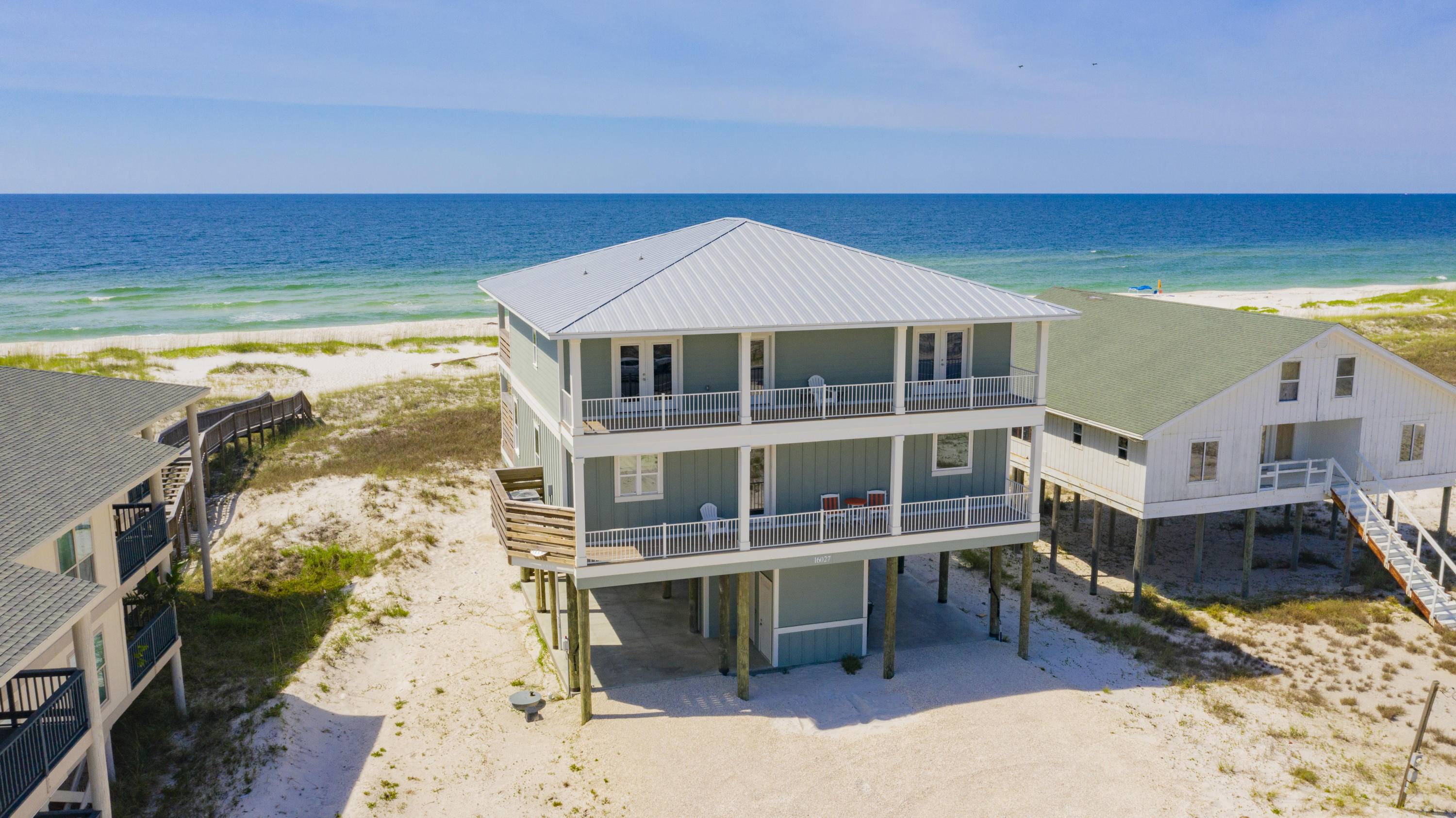INCOME PRODUCER WITH 2019 RENTAL PROJECTION AT $212K! RENTAL HISTORY AVAILABLE! TURNKEY READY - Here is your chance to own a custom-built 5 BEDROOM, GULF FRONT home perched directly on the powder white sand overlooking the Gulf of Mexico and featuring a PRIVATE POOL. Standing two stories high, this DREAM HOME offers a PRIVATE ELEVATOR, two living rooms, FOUR EXPANSIVE DECKS totaling approximately 2,760 sqft. and a POOL WITH HEATING FEATURE that measures 24'x12'. This well-designed layout offers ample room for everyone to move around and RELAX. As you enter the first floor of this exquisite home, you will be greeted by a spacious living area boasting STUNNING BEACH VIEWS. On the first floor, you will also have a large dining area and FULLY EQUIPPED KITCHEN with STAINLESS STEEL appliances