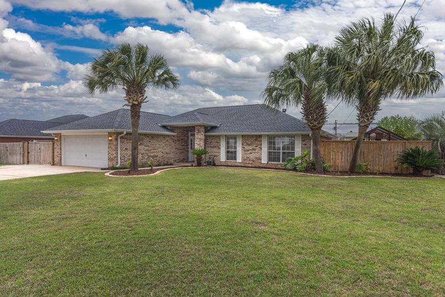 Stunning move in ready 4 bedroom 2 bath beauty ready for you and your family to call it home! Home inspection has been completed and repairs made. With fresh paint, new carpet, new roof, new privacy fence and much much more!!! This home boasts a 14k gallon gunite saltwater pool with attractive paver decking for those afternoon BBQ gatherings. Entertain your guests as they cool off in the pool while listening to music with surround sound that is wired inside and outside. Some other outdoor features to note is the 12x24 workshop with 220/110 power, roll up door, and built on lean-for additional storage, custom garden house which has a separate sprinkler system, RV/Boat parking with septic and 50amp power hook ups, sprinkler system & Bermuda grass in the backyard. The wide driveway also allows for ample parking space possibly up to 6-8 cars! As you step into your home you will right away notice the openness of the home providing a great area to watch the kiddos from the kitchen. Kitchen boasts plenty of granite counters, stainless steel appliances, and custom cabinet space to meet all your cooking needs. All cabinets in the home are soft close. The split floor plan provides the ideal privacy as you retreat to your master suite and master bath equipped with dual vanity, garden tub and walk in shower. The flex room is 20x20 and can be used as an office, toy room, or an additional bedroom. The garage has been closed in and insulated for additional heated & cooled space via a mini split system making it the ideal man cave/she-shed area!  This home is located in south Crestview providing an easy commute to all the local bases, beaches, and shopping centers. Schedule your showing today!