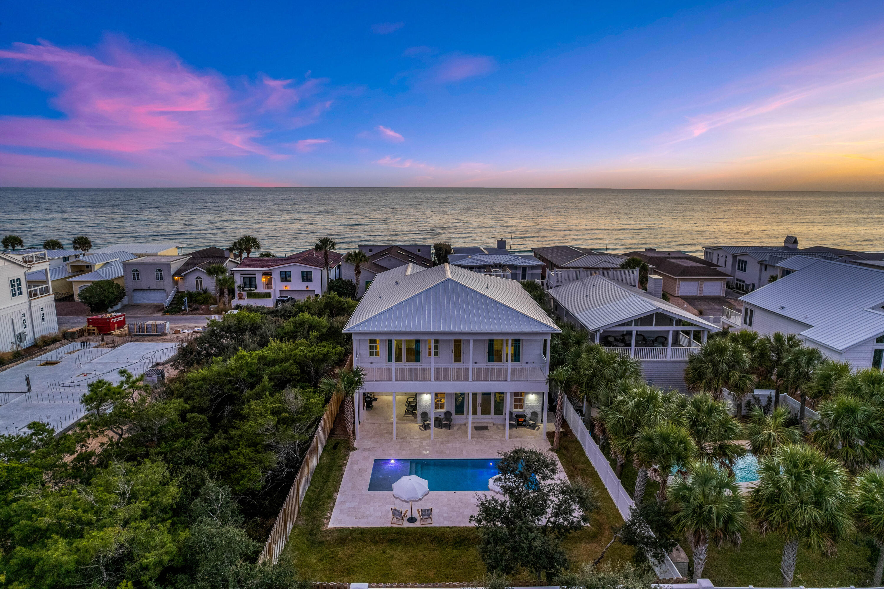 Sweeping Gulf views, new construction, and a premium location define this luxury seaside estate. Situated in the gated, non-rental Sand Cliffs community, neighboring Alys Beach and Kaiya Beach Resort. This home sits on the second tier from the beach with unrestricted views.  Because of the 18' height restriction on the Gulf front homes throughout the Sand Cliffs community, this home has sweeping views from 2nd floor and a spacious third floor deck overlooking the Gulf of Mexico. From the French door front entryway, you'll notice exceptional features including wood floors, shiplap walls, and plenty of windows letting in an abundance of natural light.