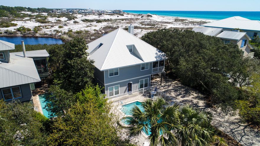 Don't miss this opportunity. No other beach development, in the area, has the unique advantage of being isolated and protected from adjacent development. Gulf Trace sits like an island on the edge of the coast, buffered on all sides by the natural world - the Gulf of Mexico and Grayton Dunes State Park to the east, north, and west. Upon entering, through the screened porch on the second floor, this newly renovated home (brand new flooring, paint and furnishings) you're overlooking the Gulf and protected coastal dune lakes of the State Park. The second floor features panoramic views from the sunroom, kitchen and dining room. Main level also features two bedrooms and a laundry room. The entire top floor is your master suite with private balcony. Bottom floor is