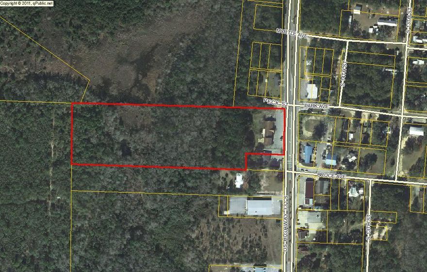 IF VISIBILITY AND ACCESS ARE WHAT YOUR COMMERCIAL ENDEAVOR REQUIRES, THIS IS THE PROPERTY FOR YOU! Large piece of commercial land in the heart of DeFuniak Springs on the most active corridor through town! 9.1 acres provides plenty of room for any commercial/business need. Approximately the front 4 acres are high and dry and the other property could be used for retention/mitigation/etc. There is an existing building, but no value is given. Take a look and let's help DeFuniak Springs grow one business at a time! Buyer to verify any pertinent information to include zoning.