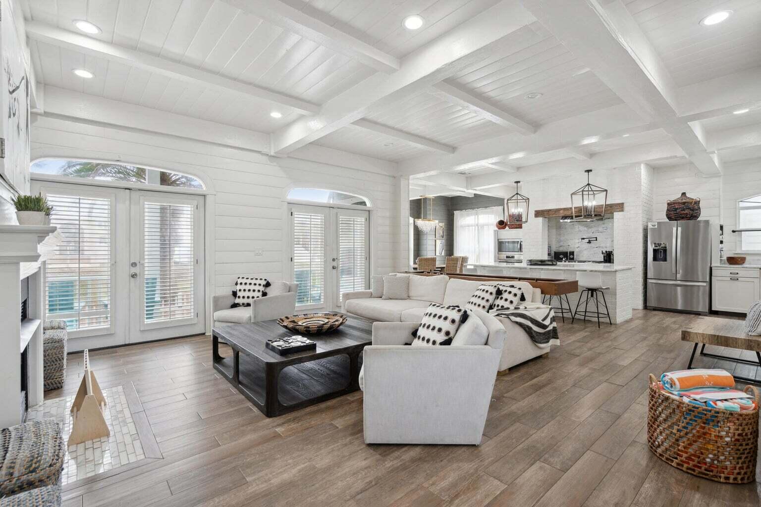 Indulge in the epitome of luxurious modern living with this exceptional vacation rental, perfectly situated in the prestigious Crystal Shores community of Destin, Florida. Unparalleled in its location, this stunning property sits directly across the street from the pristine, sugary white sandy beaches, offering a truly unbeatable coastal experience. With a capacious capacity to sleep 16 guests, this retreat is ideal for large gatherings of friends and family. Step inside and be greeted by a haven of contemporary elegance, where every detail has been meticulously curated. The main house boasts 4 bedrooms and 4.5 bathrooms, each space exuding comfort and sophistication. You'll also find a separate guest house complete with its own full bathroom, ensuring ample room and privacy for all. The allure of this property extends beyond its lavish interiors. Venture just steps away to embrace the convenience of public beach access, allowing you to effortlessly dip your toes into the Gulf's turquoise waters. For leisure on-site, take advantage of the community pool where relaxation takes on a new meaning against the backdrop of coastal beauty. The property itself has undergone magnificent updates and upgrades, including NEW French doors with hurricane-rated glass that seamlessly merge indoor and outdoor living. Immerse yourself in comfort with NEW furnishings, delight in modernity with NEW plumbing fixtures, and stay entertained with NEW ceiling fans and TVs. Endless fun awaits within the property's walls with the inclusion of a NEW Golf Cart, NEW Shuffleboard Table, and NEW Foosball Table. Even the light fixtures have been thoughtfully switched to energy-efficient LED, reflecting a commitment to both style and sustainability. This turnkey haven comes fully furnished and ready for occupancy, making it the perfect choice for your next primary residence, second home, or investment venture. The appeal of this property is undeniable.