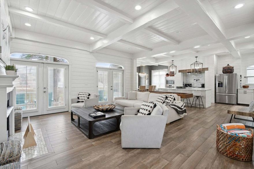 Indulge in the epitome of luxurious modern living with this exceptional vacation rental, perfectly situated in the prestigious Crystal Shores community of Destin, Florida. Unparalleled in its location, this stunning property sits directly across the street from the pristine, sugary white sandy beaches, offering a truly unbeatable coastal experience. With a capacious capacity to sleep 16 guests, this retreat is ideal for large gatherings of friends and family. Step inside and be greeted by a haven of contemporary elegance, where every detail has been meticulously curated. The main house boasts 4 bedrooms and 4.5 bathrooms, each space exuding comfort and sophistication. You'll also find a separate guest house complete with its own full bathroom, ensuring ample room and privacy for all. The allure of this property extends beyond its lavish interiors. Venture just steps away to embrace the convenience of public beach access, allowing you to effortlessly dip your toes into the Gulf's turquoise waters. For leisure on-site, take advantage of the community pool where relaxation takes on a new meaning against the backdrop of coastal beauty. The property itself has undergone magnificent updates and upgrades, including NEW French doors with hurricane-rated glass that seamlessly merge indoor and outdoor living. Immerse yourself in comfort with NEW furnishings, delight in modernity with NEW plumbing fixtures, and stay entertained with NEW ceiling fans and TVs. Endless fun awaits within the property's walls with the inclusion of a NEW Golf Cart, NEW Shuffleboard Table, and NEW Foosball Table. Even the light fixtures have been thoughtfully switched to energy-efficient LED, reflecting a commitment to both style and sustainability. This turnkey haven comes fully furnished and ready for occupancy, making it the perfect choice for your next primary residence, second home, or investment venture. The appeal of this property is undeniable.