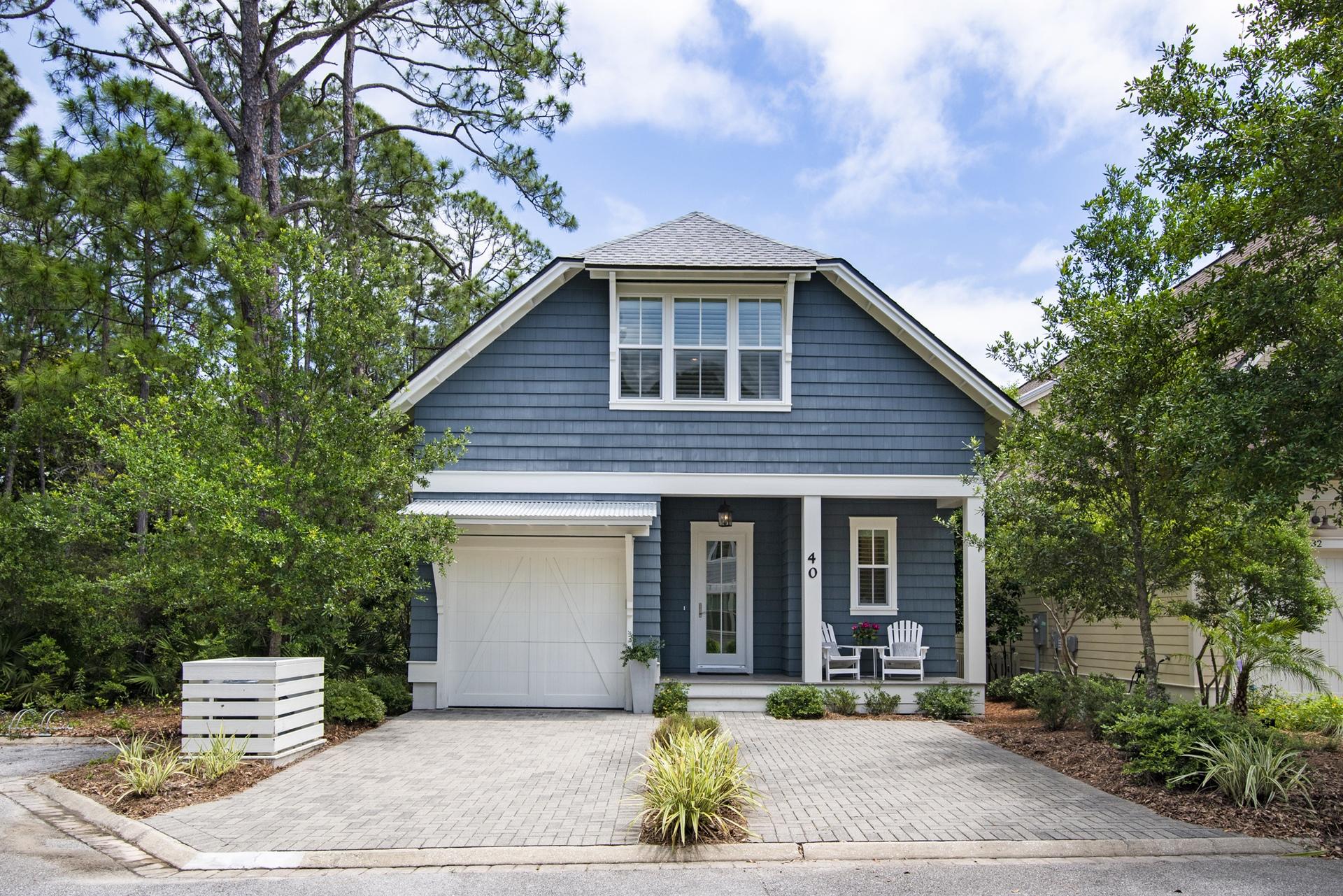 Rare opportunity to own a larger cottage style home in Watersound West Beach!  This beautiful home has the quaint feel the cottages are known for yet boasts 2705 square feet with three master suites  plus bunk room and features an open and spacious living/dining/kitchen area that overlooks a lovely screened porch and preserve area.  The kitchen is a cook's dream and features a gas stove top in the large island, upgraded cabinetry to the ceiling, beautiful quartz counters, stainless appliances, and farm sink.  The living and dining areas feature shiplap, lovely white custom roman shades, and beautiful wood floors which also flow throughout the rest of the home.  Just down the hall is a powder bath, laundry, and the first floor master featuring an upscale bath and two walk-in closets.