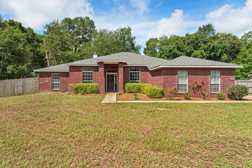 This spacious family home sits at the end of a quaint cul-de-sac, side entry garage, covered front porch and open deck surrounded by wooded perimeter and privacy fencing. Waterview Cove is a bay front community located on the north shore of Alaqua Bayou and the Choctawhatchee Bay. Enter the home and you'll be impressed with all new flooring and paint, an open and airy floor plan. There is a large living room with fireplace and also a formal dining room. Another bonus is the sun room which you enter through French doors. The kitchen and breakfast nook have beautiful tile flooring, the kitchen island with outlet, plenty of cabinet space, with a Corian island.Enjoy community boat launch with shallow water.