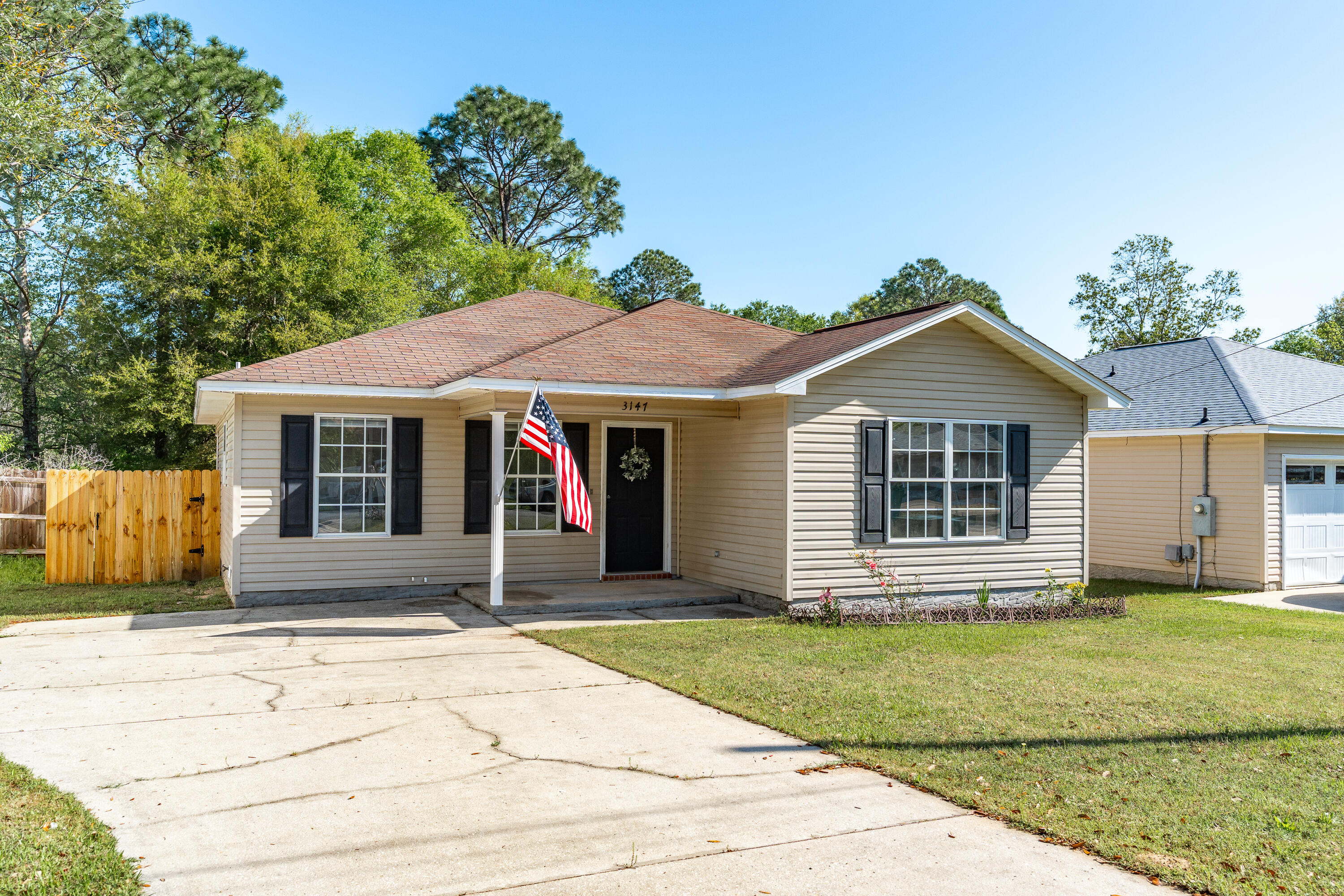 ATTENTION BUYERS--This 2008 **Tim Tarpley Construction** home comes with BONUS FEATURES! Sellers will install NEW ROOF PRIOR TO CLOSE AND SELLER IS OFFERING A GIFT WITH PURCHASE (details a little later)! #FreebiesWelcome to 3147 Forrest Avenue! This 3 BR/2 Bath lives large with VAULTED CEILING, rich walnut vinyl plank flooring, coastal blue paint, NEW LIGHT FIXTURES/CEILING FANS, NEW LANDSCAPING and a NEWER HVAC (only 3-years-old)!The galley-style kitchen offers the savvy buyer untapped equity and features oak cabinetry, black appliance suite, low-maintenance laminate countertops and spacious dining area. The laundry room is located just off the kitchen and is equipped with shelving for laundry and pantry items.(continued) The master bedroom boasts more of the rich walnut luxury plank flooring and neutral paint. While the master bath offers soaker tub/shower combination and a LARGE WALK-IN CLOSET!
Bedrooms 2 and 3 are nearly identical in size and shape, with standard closets, new ceiling fans and luxury vinyl plank flooring. There are 13 boxes of surplus lvp flooring currently on display in Bedroom #2 that will convey with purchase! #GiftWithPurchase
The guest bath offers standard tub/shower combination, with single vanity, and is conveniently located between bedrooms 2 and 3.
Now for one of my favorite areas of this home--- the backyard!
Not only do you have a covered back patio area, there is also a concrete grilling pad for your bbq pit! The backyard is flat and fully privacy-fenced. It's also bordered by mature oaks for additional privacy.
Finally, the owners expanded the driveway for additional parking (5 cars), and recently added new landscaping in the front yard.
This home is priced to move and comes with so many perks (NEW ROOF, 13 BOXES OF LVP FLOORING, etc). What are you waiting for? Make an offer today!