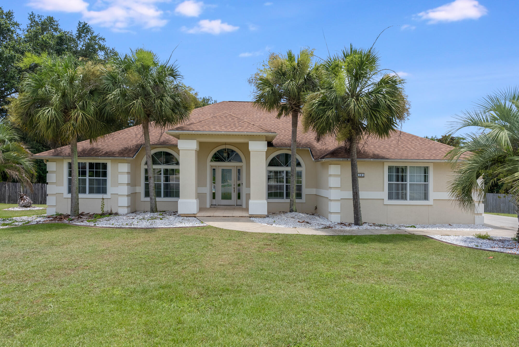 Come tour this modern, move-in-ready gem in the Creekwood neighborhood! This 4 bed, 3 bath home with sepratate office sits on over half an acre with a fully fenced yard and a beautiful screened pool. Inside, enjoy soaring ceilings, a bright open floorplan, and a chef's kitchen with quartz countertops, custom island, and pantry. The spacious layout includes a second master suite with en suite bath and private access to the pool--perfect for guests or multigenerational living. The main suite offers a walk-in closet, a spa-like separate bath and shower, and private lanai access. Tucked on a quiet cul-de-sac with a low HOA and no stairs, this home offers style, space, and comfort all on one level. Roof, HVAC and water heater have all been replaced in the past 3 years! Don't miss out!