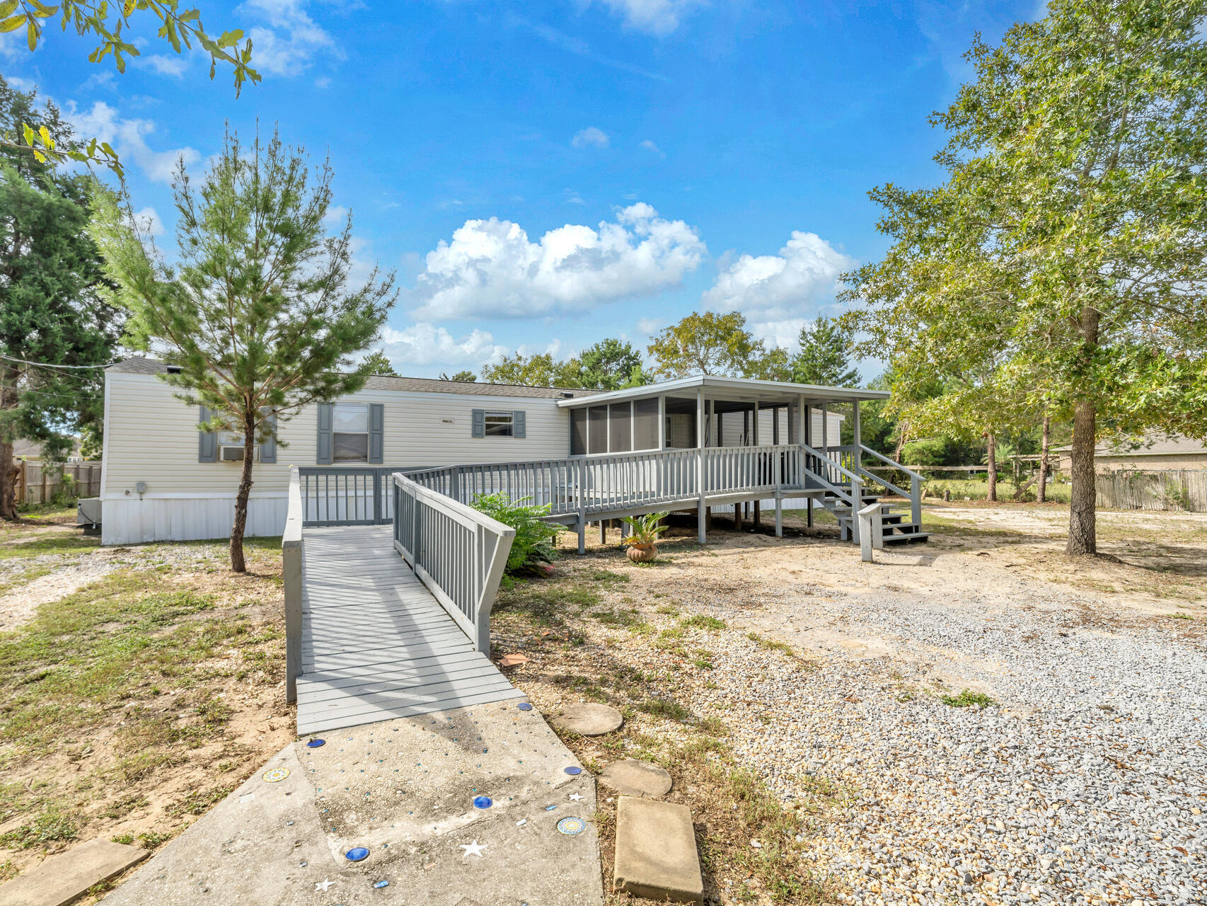 1/2 acre lot and Renovated 3 bedroom 2 bath home (year 2005) located only a short drive to the beaches, restaurants, and shopping in Navarre, FL. This home would be perfect for an owner occupant or investor! Keep in mind you need to use a VA or FHA loan if you are an owner occupant in most cases! If you are an investor, you must be cash! Most lenders do not lend on mobile homes for investors! If you want to use this an a short term rental (i.e. Airbnb),