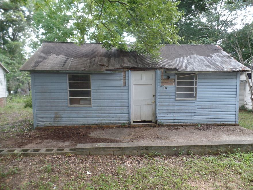 Investors wanted!! A little TLC can bring this home back to the home it was meant to be. Owner has 3 adjoining properties and is willing to sell together. Property is sold ''as is.'' Buyer to verify all square footage.