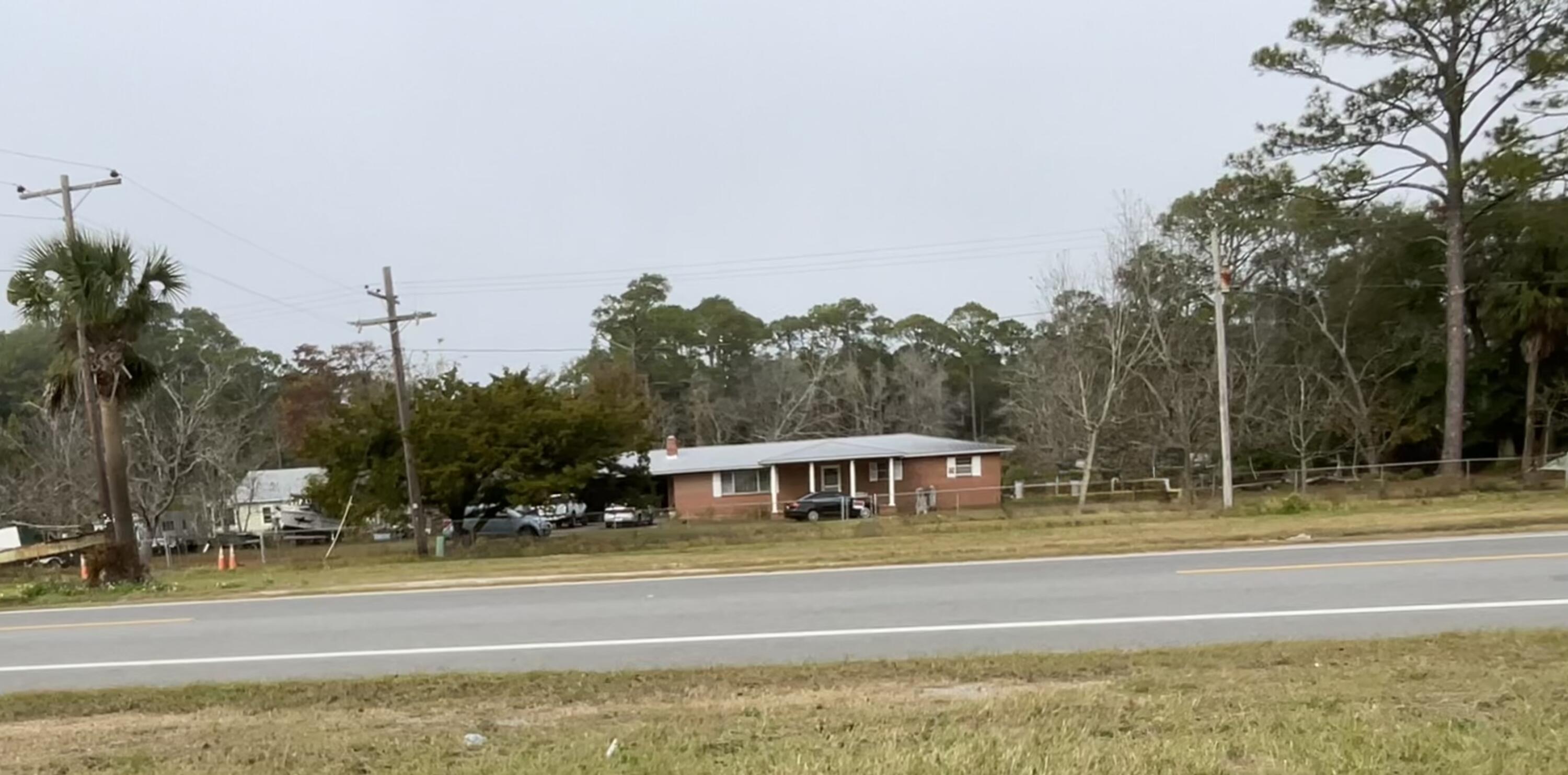 Fantastic Opportunity to own a little piece of Apalachicola History. This home sits on a 3.13 acre parcel with mixed use opportunities! This all brick home has a metal roof, 2 car carport and has been loved and cared for through the years. A well designed floorplan with great living space, large bedrooms, and lots of space to grow and prosper. Sit on your front porch and get a glimpse of the Bay while enjoying your morning coffee or evening cocktail. There are also lots of producing Pecan trees and Orange trees to enjoy. A property such as this one has so much offer and do not come on the market very often. The possibilities are endless! Call today!