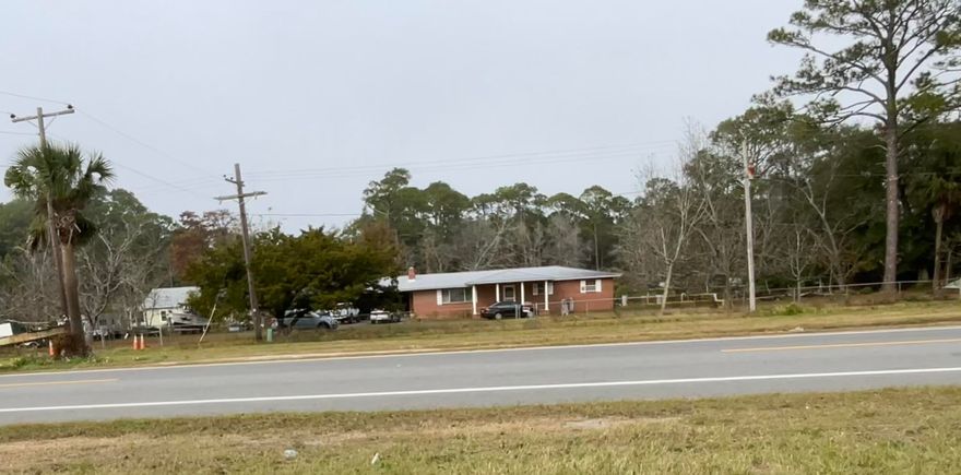 Fantastic Opportunity to own a little piece of Apalachicola History. This home sits on a 3.13 acre parcel with mixed use opportunities! This all brick home has a metal roof, 2 car carport and has been loved and cared for through the years. A well designed floorplan with great living space, large bedrooms, and lots of space to grow and prosper. Sit on your front porch and get a glimpse of the Bay while enjoying your morning coffee or evening cocktail. There are also lots of producing Pecan trees and Orange trees to enjoy. A property such as this one has so much offer and do not come on the market very often. The possibilities are endless! Call today!