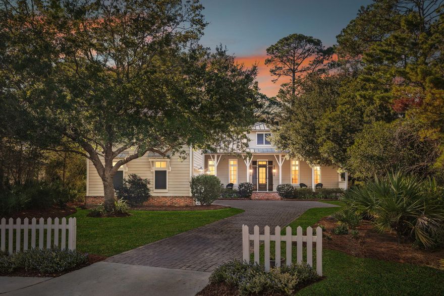 Just a short walk to the beach! This stunning custom-built home in the highly desirable Non Short Term Rental, Sea Dunes subdivision offers privacy, style, and exceptional coastal living on one of the neighborhood's largest cul-de-sac lots the yard is a gardeners dream with mature oaks and abundant Camelias and Azaleas. The private backyard backs up the preserve. Step inside the front door to a grand foyer with a domed ceiling and wood inlay compass rose floor, leading to a stately study with built-ins and beamed ceiling. The open-concept main living with it's 14' beamed ceilings, custom cabinetry, a sound system, and a masonry fireplace is a stunning area perfect for entertaining. The luxurious primary suite features a beamed ceiling, large walk-in closet, and a marble-adorned spa bathroom with double vanities, walk-in shower, and a beautiful freestanding soaking tub. The first floor also has a guest bedroom with full bath, powder room, laundry room, and a 2-car plus golf cart garage.The second floor is comprised of  the private guest suite with  its own living area with a built-in king-size Murphy kitchenette, bedroom, and full bathWonderful additional guest accomodations.Enjoy the huge front porch or unwind on the screened back porch. Move-in ready and perfectly positioned for the beach lifestylethis is coastal living at its best.