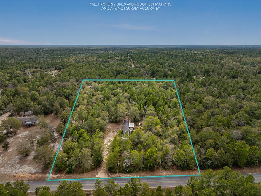 What an opportunity! 4.96 acre lot with mobile home and partial clearing. Building to be sold ''As Is - No Value.'' Established utilities on the property. AI used to show potential use of property.
