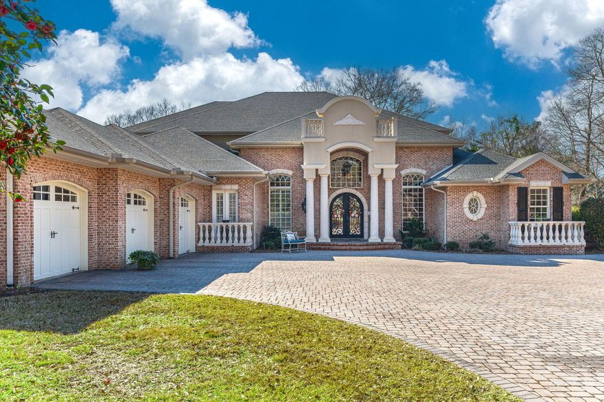 **Exquisite 5400 sqft Luxury Residence with Distinctive Craftsmanship** Step into the grandeur of this luxury 5-bedroom, 6-bathroom home that artfully spans 5400 square feet. The exterior's timeless brickwork and grand entryway give way to an interior where sophistication meets everyday living. Upon entry, the foyer unfolds into a meticulously designed space with rich hardwood floors. The ceilings are a testament to artisanal excellence, featuring imported wood inlays that elevate the home's aesthetic. Similarly, the trim work throughout the home echoes this attention to detail, imbuing each room with a sense of refinement. The chef's kitchen is a masterpiece of functionality and style, boasting state-of-the-art appliances set against custom cabinetry and lustrous