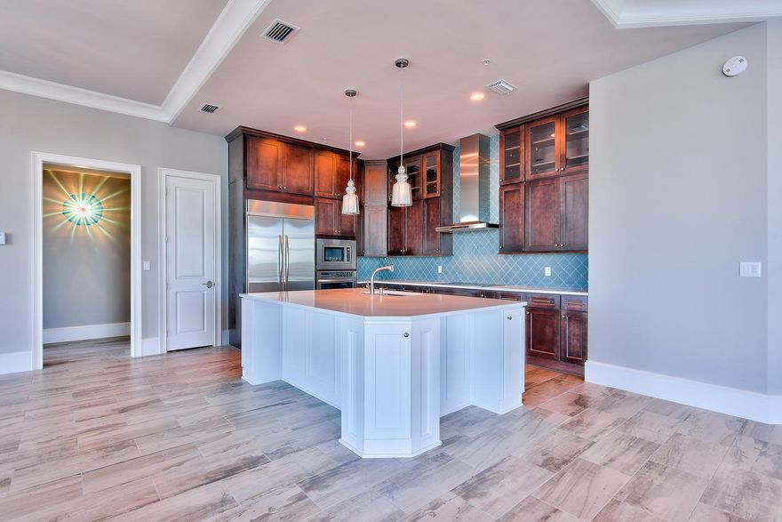 Imagine a bird's eye panoramic view of the Harbor, Gulf of Mexico and East Pass from the 1,191 sq. ft. wraparound balcony and stunning views from every room! This phenomenal brand new penthouse at Harbor Lights will take your breath away with 12 ft. ceilings, surrounding glass windows & doors, and custom luxury upgrades throughout. Condo includes a coveted 50 ft. boat slip (only two for the building), two private 1-car garages, and a huge climate-controlled storage room. This is one of the largest units in the complex and is a west corner unit with views all the way to the Destin Bridge. Being a west unit, the sunsets are breathtaking. Harbor Lights was built in 2007 but this custom penthouse was just built out and completed December 2014. The immense attention to detail is apparent.