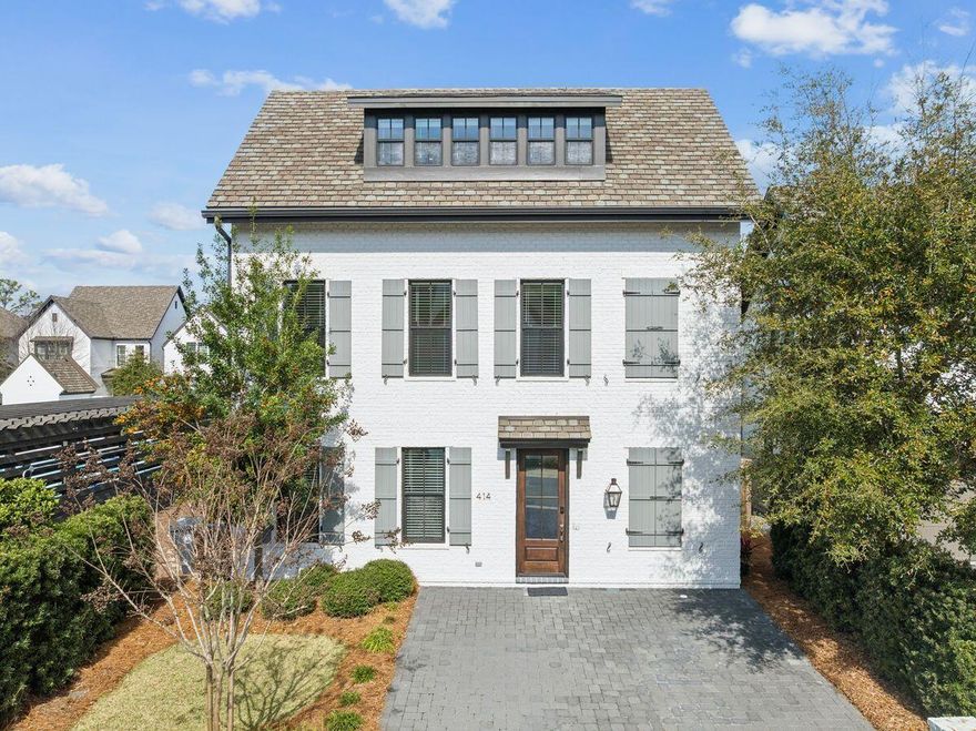 Located in the heart of Santa Rosa Beach along Scenic Highway 30A, 414 Ridgewalk Circle offers a thoughtfully designed three-story coastal home that blends timeless architectural style with comfortable living spaces and close proximity to some of the area's most desirable destinations. Positioned within a charming and manicured neighborhood and just steps from the community pool, the home provides convenient access to neighborhood amenities while maintaining a quiet residential setting.The exterior features white-painted brick with classic shutters, giving the home a clean coastal look with timeless curb appeal. Upper-level windows highlight the private primary suite that occupies the entire third floor. The property's location within the community places it directly next to the neighborhood pool and pavilion, adding to the convenience and lifestyle appeal of the home.

Inside, the first floor serves as the main living level, designed for both everyday living and entertaining. Approximately 10-foot ceilings and engineered hardwood flooring in a white oak finish create a bright and open atmosphere throughout the space. Recessed lighting and an integrated sound system add comfort and functionality, while a brick accent wall adds character to the living area. A door from the living room leads to the rear patio, creating an easy connection between indoor and outdoor spaces with an outdoor fireplace.

The kitchen and main living area flow together seamlessly, featuring quartz countertops, shaker-style cabinetry with soft-close hardware, and Frigidaire Professional line appliances. A four-burner gas cooktop is paired with a matte arabesque tile backsplash, and a Kohler sink with designer faucet sits beneath a window that brings natural light into the workspace. This level also includes a half bath with Kohler fixtures and a storage space tucked beneath the staircase.

The second floor includes two guest bedrooms, each with its own bathroom, providing comfortable accommodations for family and visitors. Each bedroom has a private bath featuring quartz countertops, porcelain tile finishes, and vanity lighting. One bath contains a combination tub/shower, while the other has a walk-in shower, both with coordinating Kohler fixtures. This level also includes a laundry closet with LG ThinQ washer and dryer.

The third floor is dedicated entirely to the primary suite, creating a quiet retreat separate from the main living areas. The bedroom features six windows that allow abundant natural light, along with the same white oak flooring found throughout the home. Ceiling fans, recessed lighting, and the integrated music system continue on this level. The primary bathroom features a double vanity with Kohler sinks, shaker-style cabinetry, and elegant vanity lighting, complemented by fixtures with a brushed bronze finish. The walk-in shower is finished in marble and includes both a rain shower head and handheld fixture, creating a spa-inspired setting. Large-format tile flooring and a window that provides natural light further enhance the space.

This level also offers excellent storage, including attic space with spray-foam insulation that houses certain mechanical components while still providing usable storage. A small flexible sitting area or reading nook provides additional versatility, ideal for a compact office or private retreat.

Just steps from the home is the Ridgewalk Circle community pool, featuring zero-entry access, decorative water features, a hot tub, and lounge seating for relaxed outdoor enjoyment. A nearby covered pavilion with picnic tables, seating areas, two gas grills, and two televisions provides a convenient space for outdoor meals, gatherings, or watching a game with friends and neighbors.

Beyond the neighborhood amenities, the home's location places it less than one mile from the Ed Walline Regional Beach Access, offering easy access to the white-sand beaches and emerald waters of the Gulf. The property is also conveniently located near the shops, restaurants, and entertainment at Gulf Place, along with popular dining spots such as Shunk Gulley. Scenic Highway 30A's walking and biking paths, boutique shops, and vibrant coastal atmosphere are all just moments away.
