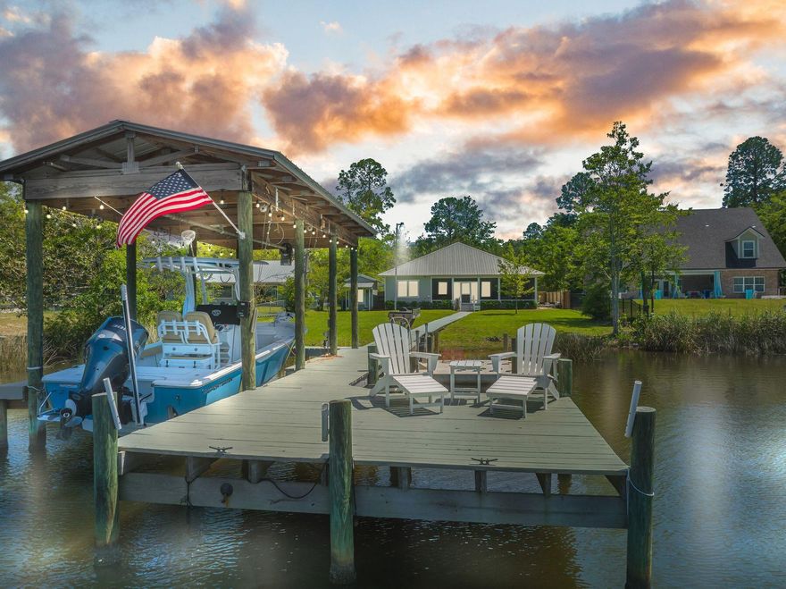 This outstanding waterfront home on Mallet Bayou offers high-end luxury living with all the extras. Set in a peaceful neighborhood, it enjoys interrupted views of nature at its best with direct water access to Choctawhatchee Bay and the Gulf of Mexico. Beyond the classic front door, there's a light and airy floor plan beneath a vaulted tongue-and-groove ceiling. Warm laminate flooring and crown molding enhance the sitting area that has ample windows and doors framing waterfront vistas. Wake up each new morning to serene views across the bayou from the spacious split-plan master suite. Make plans to entertain family and friends in the open kitchen with its gleaming granite counters, oversized island and generous prep space. Stainless appliances, a classic back-splash and large pantry with double doors make this well-planned space inspiration for keen cooks. As well as a line-up of stools at the breakfast bar there's a formal dining area for memorable evenings of togetherness. Outdoors, breathe in the fresh air and natural beauty from the screened rear porch. It's the perfect spot for chilling out at the end of the day, capturing blazing sunsets and watching birds flying home to roost. This superior home showcases many recent upgrades including new paint, a privacy fence and a paved driveway. In addition, there's a recently replaced 80-gallon water heater, Smart thermostat, new light fixtures and attractive new landscaping.Furnishings are included with a few exclusions. Life on the water comes courtesy of the 75-ft. waterfront with dock, boat lift, new jet ski floats and a fish cleaning station. There's also a separate workshop, barbecue area and carport for storing your water toys. All this just minutes from Grady Brown Park, world-class beaches, dining and shopping on 30A.