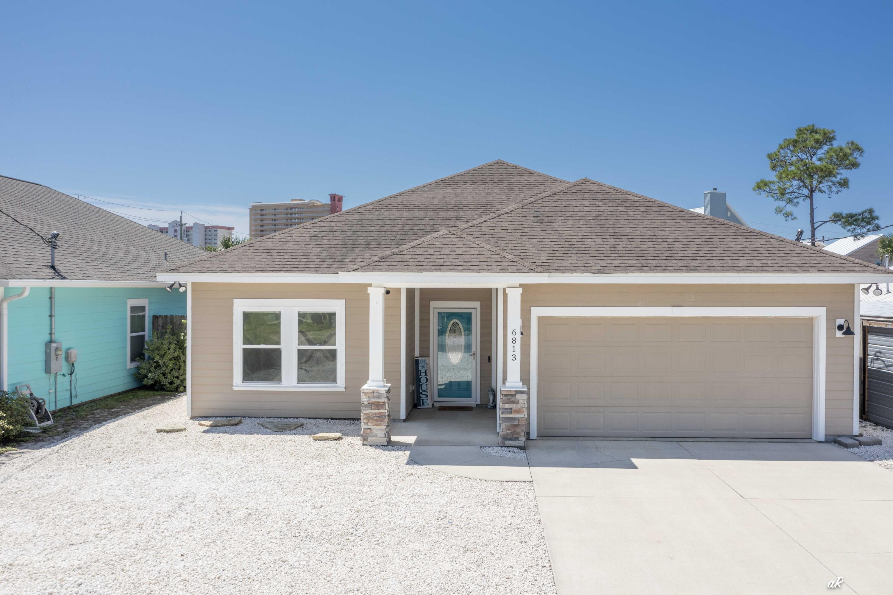 OPEN HOUSE - Saturday, September 13th from 11a-2p. Come Home to the Beach! Located on one of the most desirable streets in Panama City Beach, this stunning 3-bedroom, 2-bath home offers the perfect balance of convenience, privacy, and coastal living. Nestled between the Gulf of Mexico and Grand Lagoon, you'll be just minutes from two boat ramps, Beach Access #13, and a variety of restaurants, amusement parks, and attractions. The Navy Base and Pier Park are also a short drive away. The South Lagoon area is known for its relaxed, laid-back lifestyle residents enjoy boating, fishing, paddleboarding, and evening walks to watch the sunset. With its close proximity to marinas, local dining, and nightlife, South Lagoon is a favorite for those who want the best of both worlds: quiet residential living with quick access to all the entertainment and amenities Panama City Beach has to offer. Bonus - washer and dryer will stay! With no HOA, this property is ideal as a primary residence or as a short- or long-term rental investment. The home itself is beautifully maintained and move-in ready with a modern open-concept floorplan, abundant natural light, and a bright, clean feel throughout. The two-car garage provides excellent storage, while the well-designed layout ensures comfort and functionality across the 3 bedrooms and 2 full baths. Step outside to the large fenced backyard, perfect as-is for low maintenance living, or with plenty of room to add a pool. Relax on the covered back porch, kick off your sandals, and soak in the true South Lagoon lifestyle with colorful sunsets in your own slice of paradise. Don't miss this rare opportunity schedule your private showing today!
