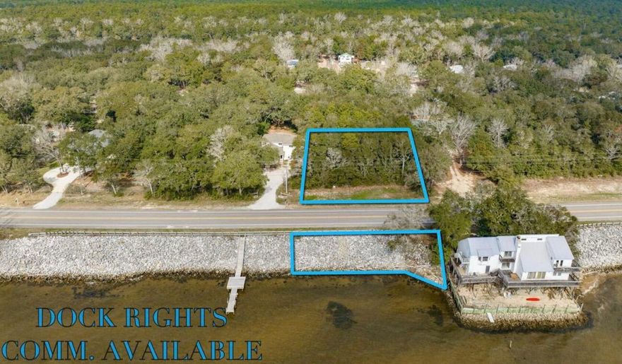 Set along the shoreline of Choctawhatchee Bay, this .78-acre bayfront parcel offers approximately 119' of water frontage and peaceful views toward Destin. The property features a level building site, mature trees, and natural palms, creating a beautiful natural setting. Dock rights are available, and the parcel is zoned for both residential and commercial use, allowing flexibility for future plans. With on-site drainage and no flood zone designation, the property is well-suited for development. Measuring approximately 216' x 119', the site is also ideally located less than 5 minutes from the Mid-Bay Bridge, and approximately 10 minutes to Destin Commons and Hammock Bay.2 parcels: 28-1S-21-41020-003-0110 & 28-1S-21-41020-002-0310List agent is spouse of the seller.