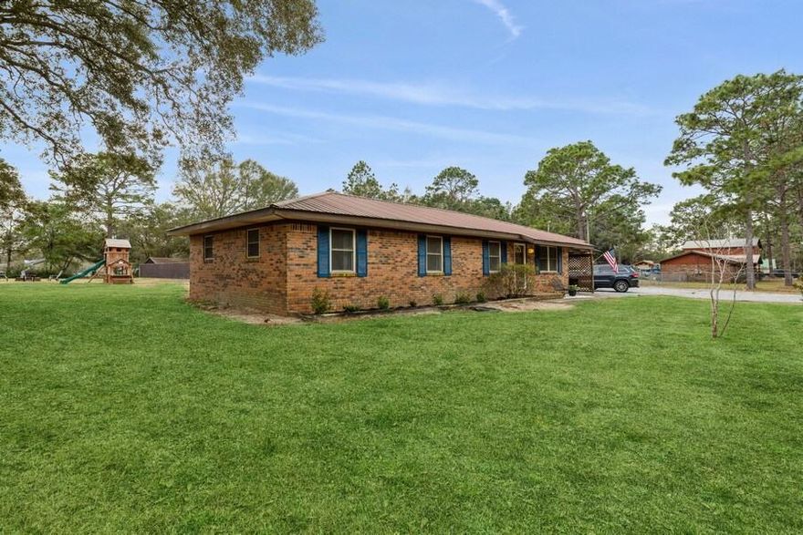 South of I-10 with 1.07 Acres and the  entire yard fenced and gated.  Large back yard great for get togethers, cookouts and large pool to enjoy sunny days in Florida.  Large the separate Mother-in-law suite or Casita, fully equipped with bathroom and full kitchen! Plus a chicken coup that produces eggs! Adorable main house with 4 bedrooms, 2 baths updated eat-in kitchen with all stainless appliances.  Enjoy the indoor laundry room with with cabinets and counter top to fold clothes on.   Separately fenced dog run or gardening area and a wood shed. This home is convenient to Duke Field and Eglin AFB. NO HOA, on well water and septic so save money on your water bill!! Open house Sunday 3/6   12 noon to 2 p.m.