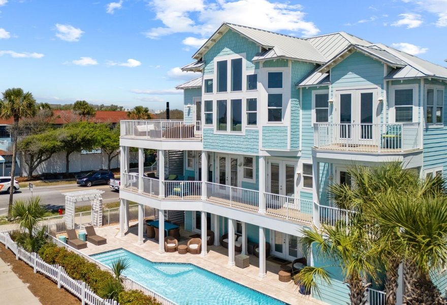 Turquoise by the Gulf at Crystal Beach, a professionally decorated and furnished luxury home features 15-foot ceilings in third floor main living area with Gulf views! Six bedrooms and seven and a half bathrooms, this home can accommodate up to 24 guests with almost 4900 Sqft. All bedrooms located on the southside and all but one are in site of the Gulf. Featuring wrap-around porches, patio and decks; enjoy the breezes even on rainy days with over 3900 Sqft of covered space. Enjoy the Sun by the large private heated pool and outdoor kitchen area with 36-inch grill, fridge, sink, 80-pound ice maker and smart TV. Complete with conditioned full bathroom and changing area. Outdoor shower located right by the gate with Hot and cold water! Inside the home you'll find top of the line everything. Travertine floors throughout with Marble in the third-floor primary bathroom. Pecky Cypress accents and whimsical d??cor throughout. Open gourmet kitchen, living and dining room is truly the masterpiece of the Home. With 15-foot ceilings and the sparkles of the Gulf Blue waters, it is the perfect spot to eat, drink and socialize. Stainless appliances include Bertozonni 48-inch gas range, Liebherr refrigerators with dual ice makers plus undercounter 65-pound ice maker, beverage fridge and two dishwashers. Two separate laundry areas with washer/dryer. Large islands with bar seating two dining tables. Two Rinnai tankless water heaters and each floor has separate air conditioner. Elevator services all three floors and has interior and exterior stairs for convenience.  
All bedrooms have custom furnishings and d??cor with all having balcony and seating area. Second floor has eat-in coffee bar area with beverage fridge and sink. Built-in bunk room and billiards room on first floor each with its own full bath. Second floor has large Primary suite with custom shower and seating area. Two adjacent bedrooms that share a bath have queen and twin bed and a full. Fourth bedroom with king bed and private bathroom and dual closets. Third floor Grand primary suite has prime Gulf views with private balcony. The entire private bathroom is covered in imported Calacatta Vagli Marble with seamless glass shower and separate soaking tub. 
Corner lot with Perfect location which backs up to Scenic 98 and only steps from the Beach. Easy, walkable access to the public beach area. Quaint community has pool and lighted sidewalks for a nice stroll. Restaurant across the street is a local's favorite with live music Thursdays, Fridays and Sundays. Come check out this unique Destin Luxury home! 


