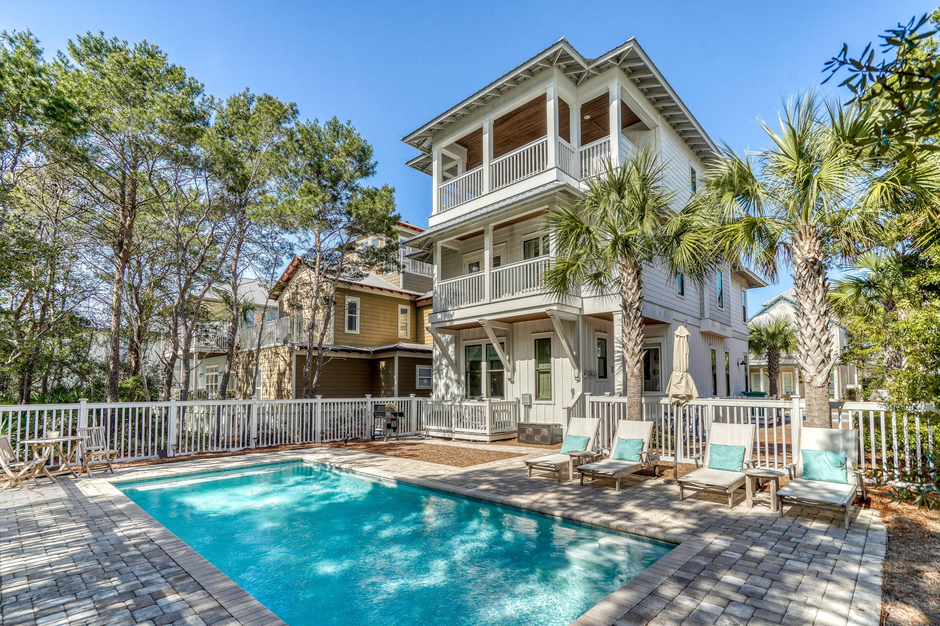 Come see why everyone loves living in Seacrest Beach. This home was designed to impress from the moment you walked in. As you enter the home your eyes are immediately drawn to the beautiful finishes and decor that the kitchen and dining room have to offer. The first floor is also home to the first of five bedrooms. You will find three additional bedrooms as you make your way to the second floor. One of the oversized bedrooms on this floor can serve as a second master suite. Now the true master suite encompasses the entire third floor. There is a separate lounge area before you enter the suite as well as massive third floor porch with an outdoor kitchen. This is only one of the few homes in Seacrest Beach that offers a private pool to enjoy your piece of paradise.
