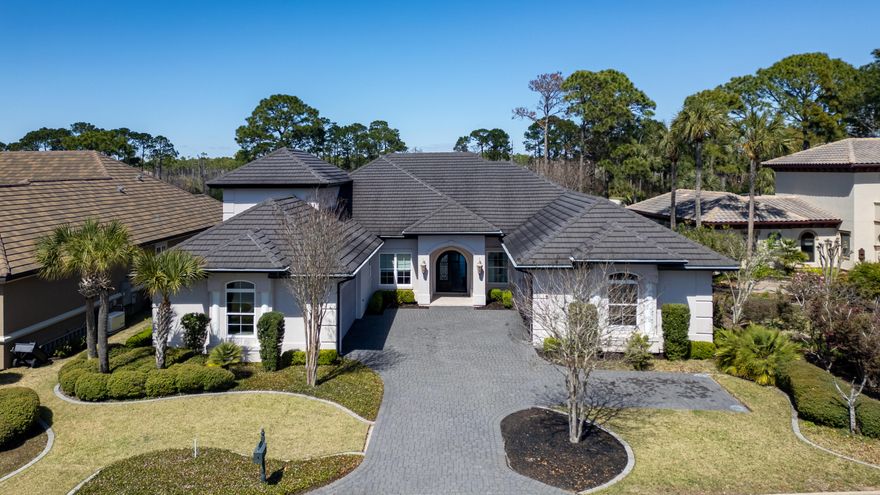 A Masterpiece of Custom Craftsmanship in Regatta Bay ... Coming SoonThis is not a spec house. This is a vision brought to life--a collaboration between discerning homeowners and renowned builder Ronny McGee, whose architectural artistry and meticulous craftsmanship have defined luxury living throughout 30A.From the moment you approach the custom-designed, double-arched wrought iron front entry doors, you'll sense this home is different. Where others see walls, McGee saw canvas--adorning select spaces with exquisite metallic impressions and textured finishes that shift with the light, creating an ever-changing interplay of depth and luminescence. The formal dining room, great room, and master ensuite become living works of art through this distinctive technique. Architectural Details That Captivate
The front living room commands attention with three wide faux beams stretching dramatically across the ceiling, complemented by by custom-built shelves and cabinetry that blend beauty with functtion. These aren't afterthoughts - they're integral to McGee's vision of spaces that inspire.

A Kitchen Designed For The Culinary Enthusiast
The gourmet kitchen is a chef's dream: a professional-grade Thor six-burner gas range with griddle, GE Profile refrigerator and a whisper-quiet Bosch dishwasher. The space flows seamlessly into the family area, creating the heart of the home where culinary creativity meets comfortable conversation. A sun-drenched breakfast nook overlooks the fourth green while a sophisticated wet bar near the entry sets the stage for effortless entertaining.

Designed For Life, Not Just Living
Every square foot of this 3-bedroom en suite home serves a purpose. McGee's philosophy- "leave nothing unusable"- manifests in thoughtful touches throughout: a private first-floor office or gathering room, an additional storage room and even a study-nook tucked down the hall.  
Step onto the screened porch, and the fourth green becomes your private vistaequally perfect for morning coffee in solitude or afternoon entertaining with friends.

Intelligent Design Meets Modern Living
Built in 2018 with intention and foresight, this home offers two separate two-car garages plus additional parking - a rarity that speaks to practical luxury. The primary living spaces reside on the first floor, while a private en suite bedroom upstairs provides the perfect retreat for guests or family seeking their own sanctuary.

Modern conveniences include a central vacuum system, tankless water heater and abundant storage, but it's the irreplaceable details that set this home apart ...the artisan wall finishes, the custom wrought iron entry doors, the architectural ceiling beams, the thoughtful sight lines, the flow that only comes from true collaboration between builder and client.

Currently undergoing professional detailing - carpets, windows and ductwork meticulously refreshed to ensure this extraordinary home makes the perfect first impression.

This is what custom-built means: a home designed not for everyone, but for someone who recognizes the extraordinary.

Schedule your private showing and discover the Regatta Bay home where architectural vision meets everyday elegance.
