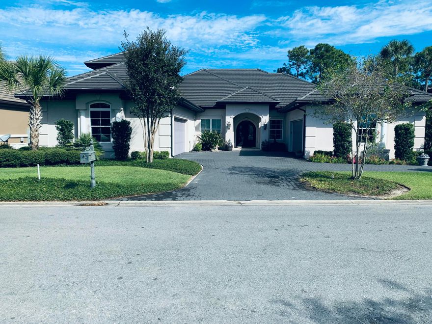 A Masterpiece of Custom Craftsmanship in Regatta Bay ... Coming SoonThis is not a spec house. This is a vision brought to life--a collaboration between discerning homeowners and renowned builder Ronny McGee, whose architectural artistry and meticulous craftsmanship have defined luxury living throughout 30A.From the moment you approach the custom-designed, double-arched wrought iron front entry doors, you'll sense this home is different. Where others see walls, McGee saw canvas--adorning select spaces with exquisite metallic impressions and textured finishes that shift with the light, creating an ever-changing interplay of depth and luminescence. The formal dining room, great room, and master ensuite become living works of art through this distinctive technique. Architectural Details That Captivate
The front living room commands attention with three wide faux beams stretching dramatically across the ceiling, complemented by by custom-built shelves and cabinetry that blend beauty with functtion. These aren't afterthoughts - they're integral to McGee's vision of spaces that inspire.

A Kitchen Designed For The Culinary Enthusiast
The gourmet kitchen is a chef's dream: a professional-grade Thor six-burner gas range with griddle, GE Profile refrigerator and a whisper-quiet Bosch dishwasher. The space flows seamlessly into the family area, creating the heart of the home where culinary creativity meets comfortable conversation. A sun-drenched breakfast nook overlooks the fourth green while a sophisticated wet bar near the entry sets the stage for effortless entertaining.

Designed For Life, Not Just Living
Every square foot of this 3-bedroom en suite home serves a purpose. McGee's philosophy- "leave nothing unusable"- manifests in thoughtful touches throughout: a private first-floor office or gathering room, an additional storage room and even a study-nook tucked down the hall.  
Step onto the screened porch, and the fourth green becomes your private vistaequally perfect for morning coffee in solitude or afternoon entertaining with friends.

Intelligent Design Meets Modern Living
Built in 2018 with intention and foresight, this home offers two separate two-car garages plus additional parking - a rarity that speaks to practical luxury. The primary living spaces reside on the first floor, while a private en suite bedroom upstairs provides the perfect retreat for guests or family seeking their own sanctuary.

Modern conveniences include a central vacuum system, tankless water heater and abundant storage, but it's the irreplaceable details that set this home apart ...the artisan wall finishes, the custom wrought iron entry doors, the architectural ceiling beams, the thoughtful sight lines, the flow that only comes from true collaboration between builder and client.

Currently undergoing professional detailing - carpets, windows and ductwork meticulously refreshed to ensure this extraordinary home makes the perfect first impression.

This is what custom-built means: a home designed not for everyone, but for someone who recognizes the extraordinary.

Schedule your private showing and discover the Regatta Bay home where architectural vision meets everyday elegance.
