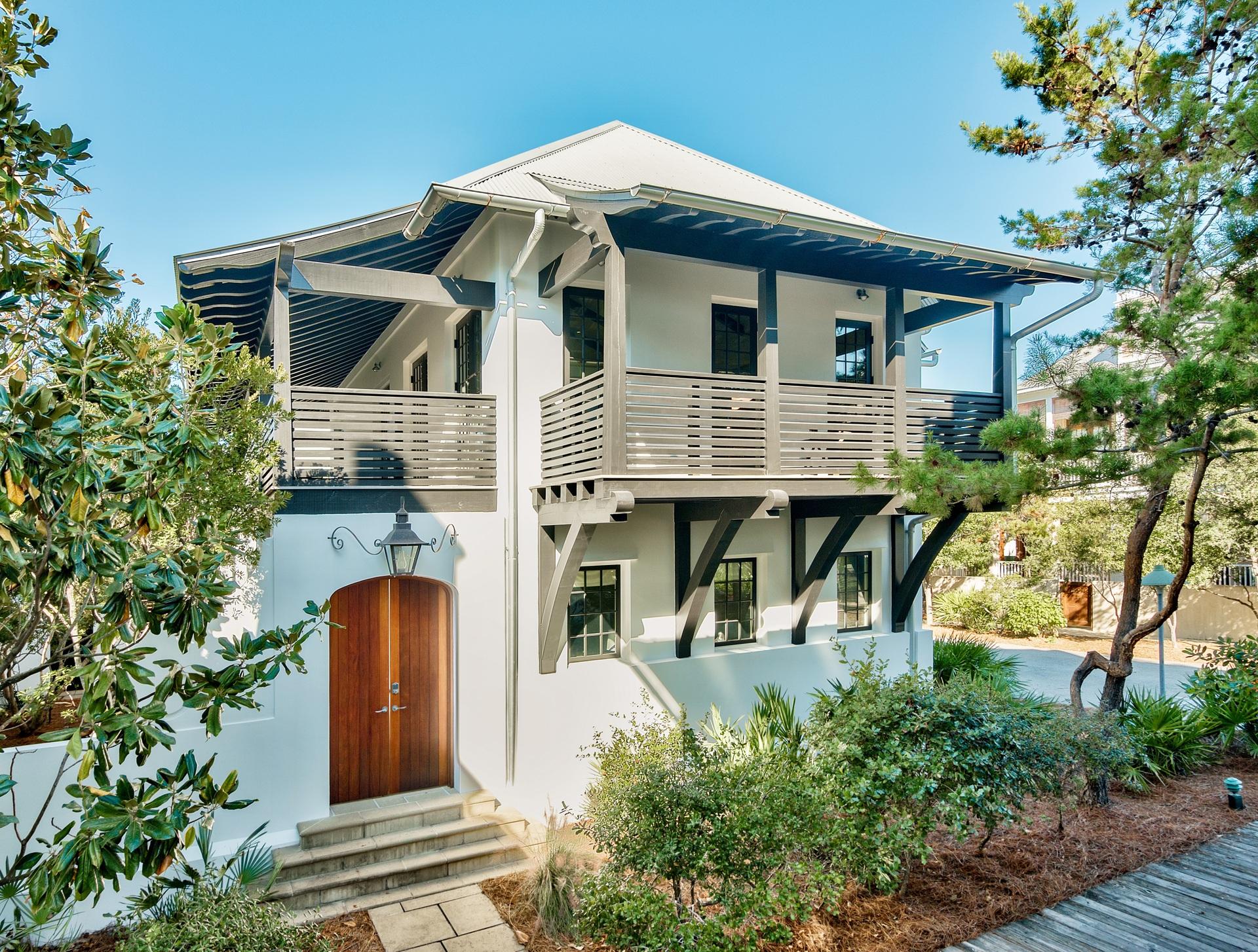 The perfect get away! This home is perfectly placed South of 30A, steps from the Town Center, around the corner from the Barbados pool and just down the boardwalk to the white sandy beaches of the Gulf of Mexico. Designed by renowned architect, Julia Starr Sanford and built in 2008. Enjoy the private courtyard of the main house and listen to the tranquil sounds of the soothing fountain or relax on the elevated sundeck under the pergola. Enjoy outdoor dining on the upstairs covered terrace just through the French doors off the kitchen and living room. The wood beam cathedral ceiling frames an upstairs room designed for beach living at its best---an open, light filled space with a custom dining bench and built in shelves, professional kitchen and open living area.
