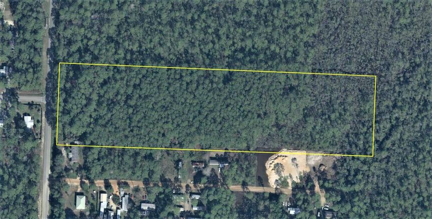Developers or investors. snatch up this beautiful 10 acre parcel currently zoned for 2 residential units per acre on paved county rd. with public sewer and water.  Land use amendment to 4 RSF Units per acre is in process. Environmental Assessment, attached in Documents, shows approx. 8 acres of uninterrupted uplands in Flood Zone X ! The little finger of wetlands at the front of the parcel is believed to be man made and of little impact.    This is a wonderful, sought after location,  just a short walk to Bay access just at the end of the street and approximately five minutes drive to Gulf Beach Access and a short distance to Ascension Hospital, great shopping, dinning and entertainment.