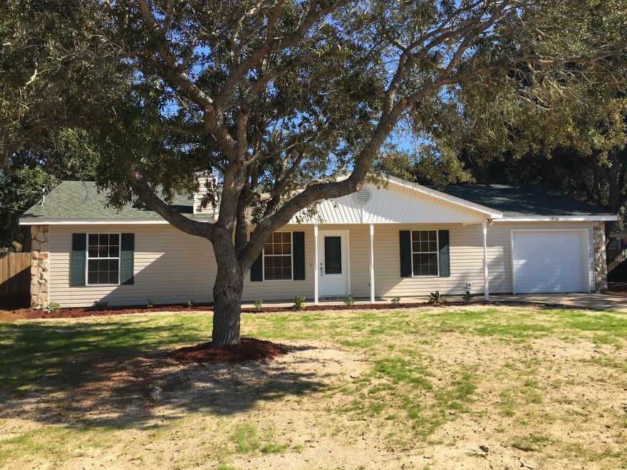 FINANCING FELL THROUGH & BACK ON MARKET!Peaceful Navarre Living. Nestled just 1 minute away from Publix grocery and shopping, 5 minutes to beaches and a short walk to elementary school.ALL NEW: carpet, interior/exterior doors & hardware, double window panes,smoke alarms, bath fixtures, garage door w/auto opener & window blinds & attic pull downs. 25 yr. Roof replaced 2005 & is above code rated, water heater 2014, ALL electrical inspected & Guaranteed, smooth knockdown & vaulted ceilings, Crown molding and ceiling fans throughout, Cherry finish Bamboo flooring and tile in main areas, Huge fenced back yard, Large Shed, Garage shelving, Double Gate, Fresh Landscaping, Septic pumped and inspected, Beautiful Oaks, HOME WARRANTY and washer/dryer INCLUDED. DON'T MISS IT. CALL TODAY.