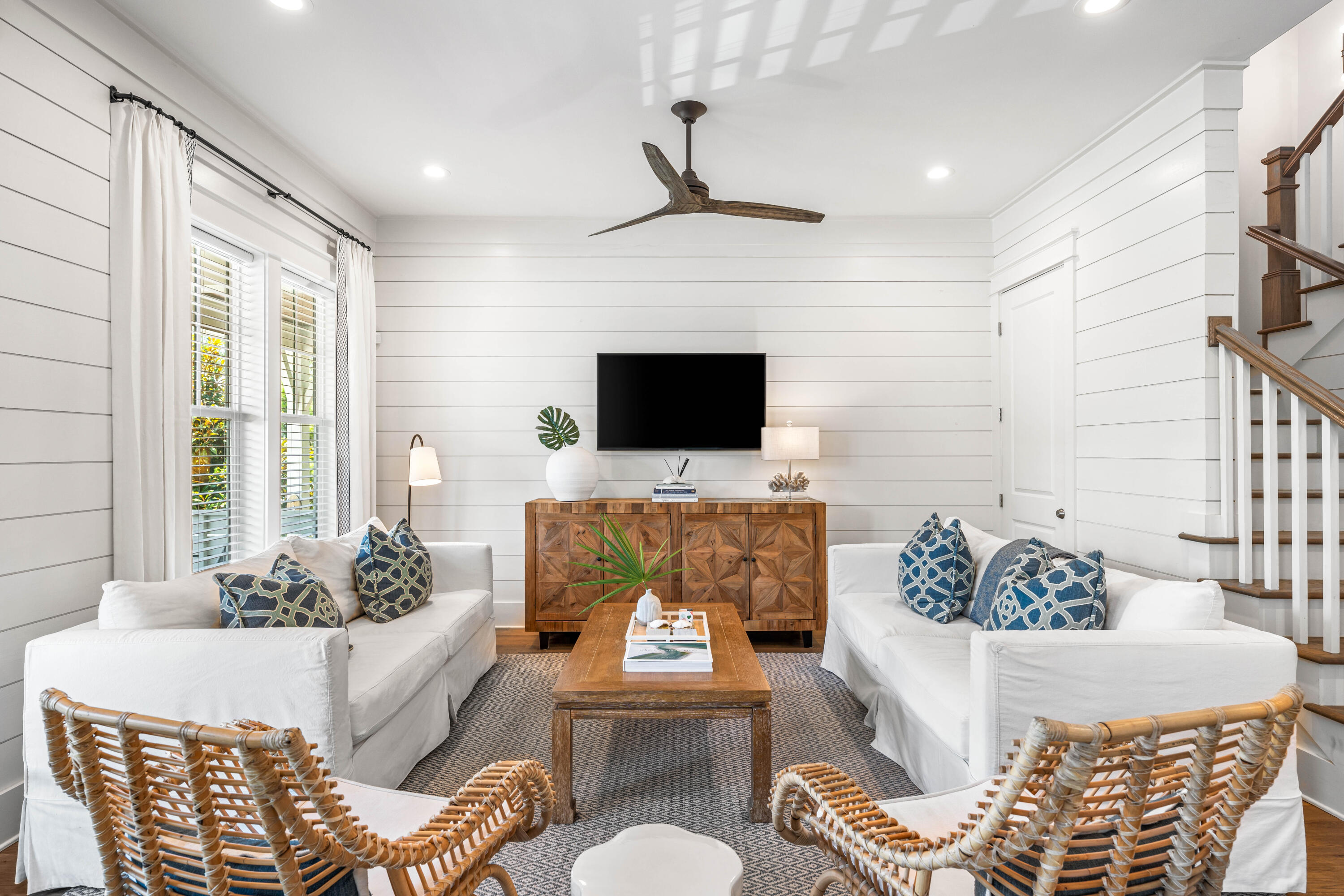 Chic beachside living in the heart of Blue Mountain Beach just steps from Scenic Highway 30A! This three-level 4BR/4.5BA home offers nearly 2,700 square feet of perfectly planned living spaces and includes a 6 seater golf cart. Trending details throughout include shiplap walls, hardwood floors, 10' ceilings, designer lighting fixtures, and a neutral color palette with accent pops of wallpaper and coastal blue hues. On the first level, find open concept living and dining with a Sonos surround sound system and a beautifully appointed kitchen featuring a quartz breakfast bar, white cabinetry, Kitchen-Aid appliances including a 6-burner range, and a filtered H20 system. One of two primary suites is located on the first level with dual closets and a lovely ensuite along with a powder room for added convenience. The second primary suite and two guest rooms with a shared bathroom are located on the second level along with a laundry room. On the third level, find a spacious secondary living area with a separate gaming/media space, a bunk room that accommodates six, and a full bathroom.
Nestled alongside the Point Washington State Forest with its miles of hiking and biking trails, Lakeside at Blue Mountain is a charming boutique community of cottage-style homes with a community swimming pool, exercise room, clubhouse, and walkway leading to Redfish Village with shopping and dining and nearby public beach access. This immaculate home presents an outstanding opportunity for a primary home, personal retreat, or investment property in a prime location convenient to Grayton Beach, Seaside, WaterColor, and more!