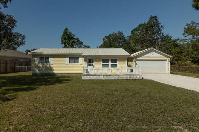 Need some Sunshine in your life? Found It! Welcome to the Sunshine Cottage. This beautiful 3 bedroom/1.5 Bath home with large 2 car detached garage is situated on an oversized .45 acre lot AND Move-In Ready! Some of the fantastic features this home includes are, Crown molding, 2022 NEW A/C, 2022 NEW Hot water heater, recently replumbed with PEX pipes, LED lighting, Stainless appliances in kitchen and lots of cabinets and counterspace make cooking a breeze. Gorgeous Pine wood flooring in the living room, NEW commercial grade carpet in the hallway and bedrooms. The bonus room could easily be converted into an additional bedroom or extended family suite. The list of fabulous features goes on and on, so come see for yourself and make it your own! All that is missing is YOU!