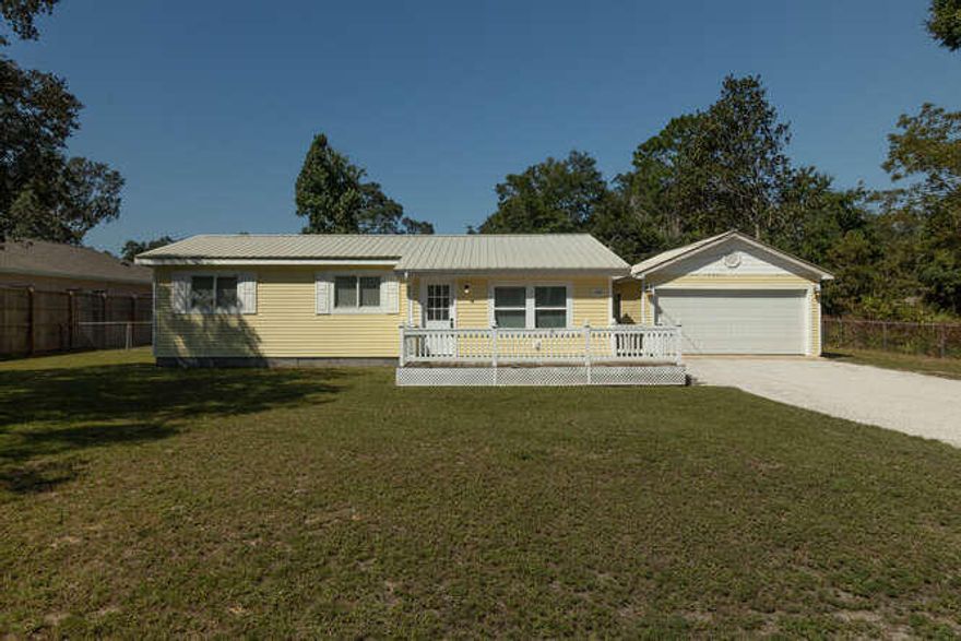Need some Sunshine in your life? Found It! Welcome to the Sunshine Cottage. This beautiful 3 bedroom/1.5 Bath home with large 2 car detached garage is situated on an oversized .45 acre lot AND Move-In Ready!  Some of the fantastic features this home includes are, Crown molding, 2022 NEW A/C, 2022 NEW Hot water heater, recently replumbed with PEX pipes, LED lighting, Stainless appliances in kitchen and lots of cabinets and counterspace make cooking a breeze. Gorgeous Pine wood flooring in the living room, NEW commercial grade carpet in the hallway and bedrooms. The bonus room could easily be converted into an additional bedroom or extended family suite. The list of fabulous features goes on and on, so come see for yourself and make it your own! All that is missing is YOU!