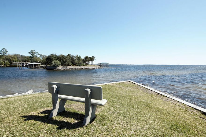 Attention to detail is evident in the sought after gated community of FinisterrA. Located on the Choctawhatchee Bay, across the street from Shalimar Yacht Basin. This 2 bedroom/1 bath unit is well maintained and features granite counter tops and ceramic tile flooring. Gated complex includes an in-ground swimming pool, tennis courts, laundry facility, kayak racks and a clubhouse. Only a five minute drive to Eglin AFB's main gate.Note to investors Finisterra can be rented.