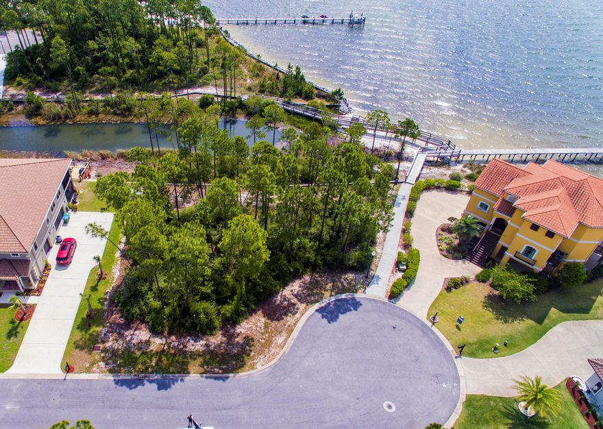 Amazing waterfront lot with deeded boat slip in exclusive Palmetto Lake Preserve. One of Navarre's newest gated communities featuring Mediterranean style custom homes, underground utilities, dock & beach. Build your dream home on this amazing, unobstructed sound view property. Only minutes to Hurlburt Field, shopping, schools and beaches.