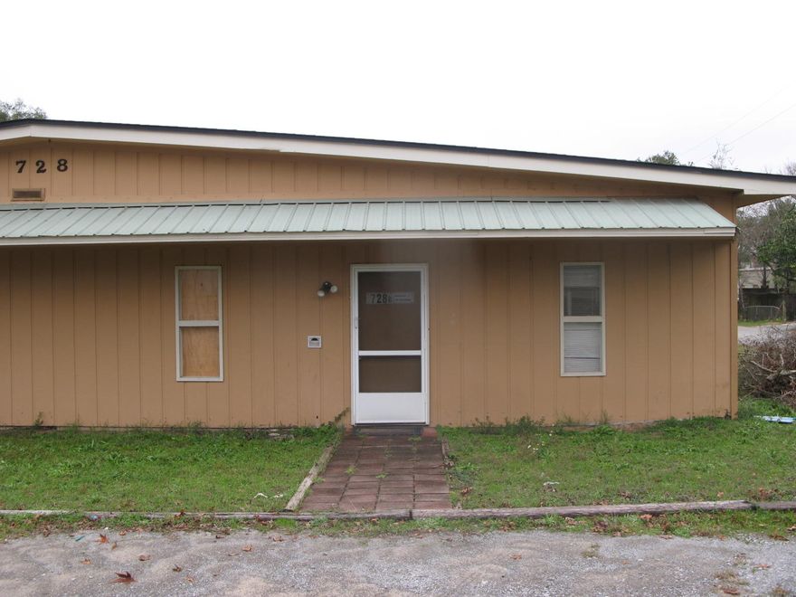 Warehouse with 2 offices, 1 restroom, loading dock, 2 rollup doors approx. 7 foot tall.