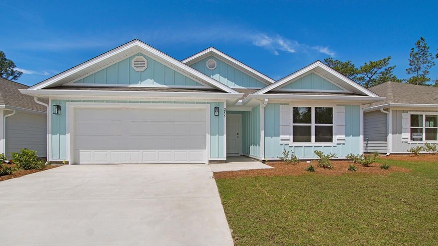 255 Eunola Lane, a new home at Ashton Park Phase III in Freeport Florida. This home is ready for move in and features four bedrooms and two full bathrooms as well as a two-car garage. As you enter this home you will find a bright hallway that leads to the expansive and open living area. The open concept design of this floor plan affords a comfortable living space. With windows along the back of the home and access to the outdoor patio, this space has plenty of natural lighting. This kitchen is equipped with stainless steel appliances including a smooth top stove, microwave and dishwasher as well as granite countertops. The primary suite is located at the back of the home where the ensuite bathroom features two large closets and a double vanity.