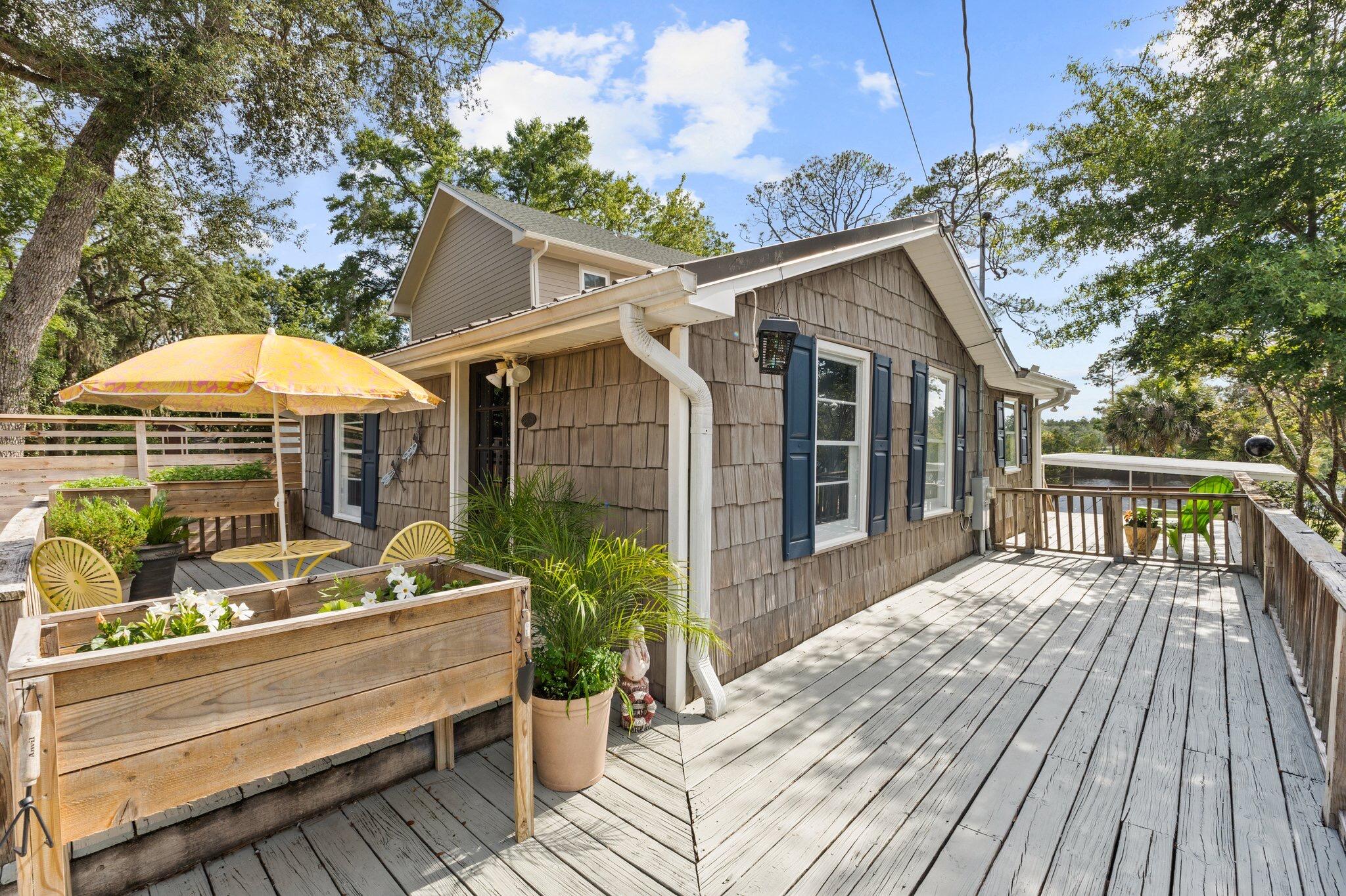 Discover a quirky, historic fish camp cottage just 5 mins from PCB Airport! Once visited by legends like George Jones, this 2-bed retreat features bay access, private dock, hot tub, & screened porches. Ideal as a cozy getaway or STR investment. Near Hwy 79 growth, beaches & dininga'own a true piece of coastal charm!