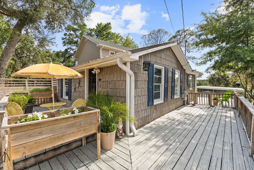 Discover a quirky, historic fish camp cottage just 5 mins from PCB Airport! Once visited by legends like George Jones, this 2-bed retreat features bay access, private dock, hot tub, & screened porches. Ideal as a cozy getaway or STR investment. Near Hwy 79 growth, beaches & dininga'own a true piece of coastal charm!