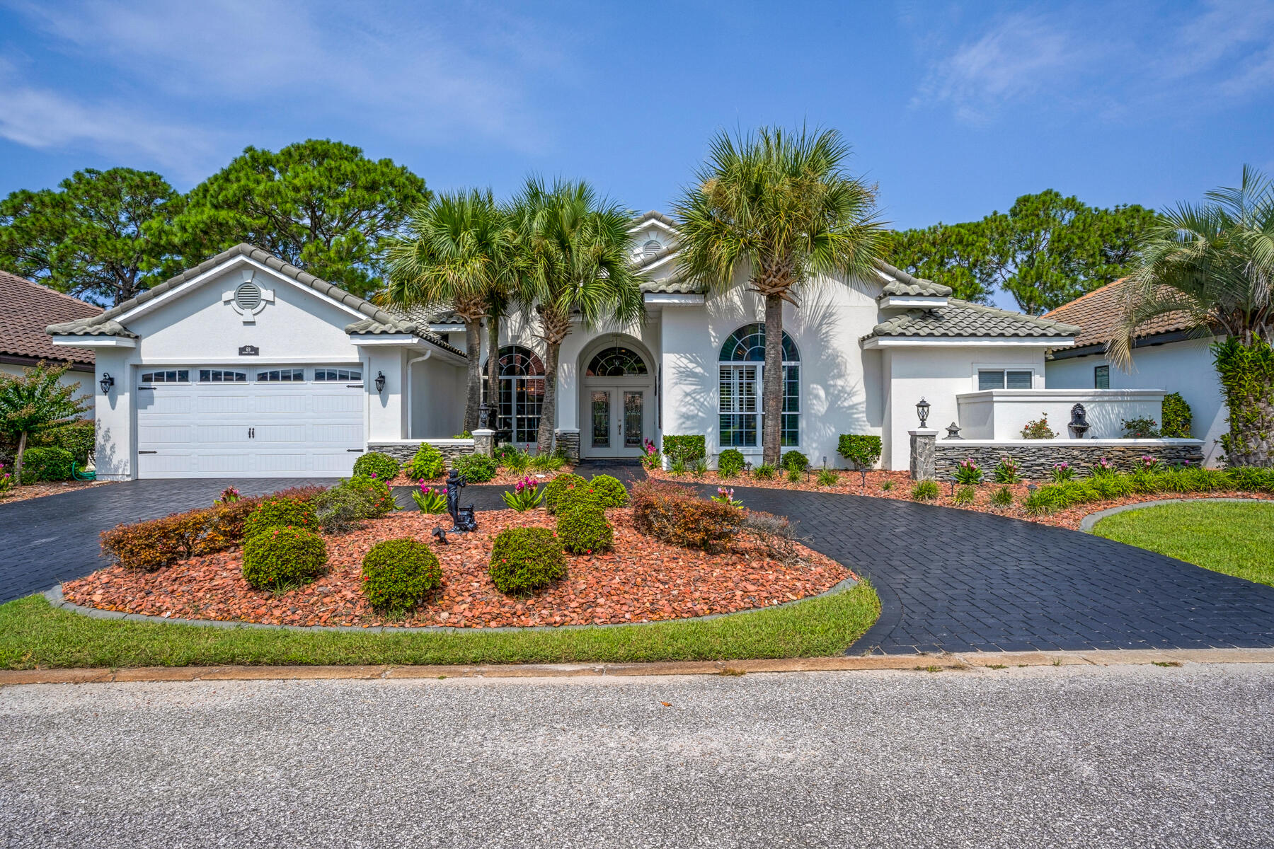What a beautiful home on a lovely and quiet cul-de-sac!!! This one level white stucco/stone residence features a NEW BLACK TILE ROOF (4/24) and a circular driveway with black pavers. This along with the beautiful landscaping makes a great street impression. The well -designed floor plan wows with an abundance of natural light seen from your first steps through the glass patterned double front entry doors. Your eyes will be greeted with a magnificent view of the open concept home, pool area and the 17th Bay green/fairway of the Emerald Bay Golf Course.This remarkable all tiled residence features 3 bedrooms and 3 full bathrooms - 2 bathrooms with walk-in showers. There is also a large office with built in book shelves, cabinets, full closet and ceiling fan. Upgrades 6 years & newer include granite countertops in master bathroom, A/C system, a Generac full-house generator, kinetic pro water care system (to prevent rust) and a new pool heater.
This one level home was renovated and totally repainted in 2019 and has a very open floor plan with many windows and great views of the golf course. Stroll through the entry way into the large rooms with 12 foot soaring ceilings, beautiful crown molding, ceiling fans and surround sound speakers. The floor to ceiling mirrored dining room sparkles with a crystal chandelier and is perfect for family dinners and formal dining occasions. The welcoming foyer, living room, dining room, kitchen, breakfast nook and family room all connect and flow and look out onto the screened-in pool/spa lanai which features pocket sliding doors that totally push into the walls so the entire house feels like being both indoors and outdoors at the same time. This is the place you have been searching for relaxed living and easy entertaining. You can lounge by the pool/spa and watch the golfers go by on the fairway or view the putting on the 17th green. The pool area also features a flat screen TV, gas grill and outdoor lighting in front and back of the house. A new pool heater was installed in 2023 and a full house generator in 2022.
The master suite occupies the entire north side of the house and offers a soothing respite from your days' activities. The master bedroom features a beautiful tray ceiling, tiled wood flooring, ceiling fan and a sliding glass pocket door out to the screened in pool area.
The master bathroom boasts a walk-in closet, walk-in shower, jacuzzi oval-shaped soaking double, granite double sink vanities and a toilet closet. The large bathroom window out to the privacy garden wall fills the room with an abundance of natural light.
The well-appointed kitchen boasts granite counter tops, custom milled cabinetry, stainless steel appliances, gas cook range/oven, pantry, Culligan water filter and a dining counter. The kitchen area has a breakfast nook with views of the pool and golf course.
The kitchen area flows into the comfortable family room which features an inset for a large flat screen TV and also showcases a 75 inch attractive electric fireplace that operates via a remote. The family room has sliding glass pocket doors that provide easy access to the pool area.
The second and third bedrooms feature wood tiled floors, ceiling fans and full bathrooms. The third bedroom showcases a built-in Murphy Bed in a beautiful frame. This bed can easily be raised into the wall enclosure if you wish to use this room for other purposes. And the attached third bathroom has a walk-in shower and an outside door entrance for access to and from the pool area.
Emerald Bay is a prestigious golf course community on the Choctawhatchee Bay in Destin Florida with a community swimming pool, guest house and two soft surfaced tennis course. Located near the Mid Bay Bridge with shopping, dining, recreation and entertainment nearby, Emerald Bay is a desirable Bay Side neighborhood that is a short distance from the beach. The Emerald Bay Clubhouse includes a full-service pro shop and "The Grille" offers a full bar and indoor/outdoor dining. The restaurant's outdoor covered porch and fireplace overlooks the 18th green and is a perfect place to meet friends and enjoy a bayside lifestyle.
This is a must see Coastal Residence for those seeking elegant relaxation in their golf course home with lovely bay breezes and stunning views. Property to be sold "AS IS". Furnishings negotiable by separate agreement.
Seller is a licensed Real Estate Broker..
