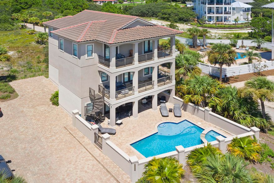 Gulf Views in Front + Coastal Dune Lake in Back = Pure 30A Perfection. As if this perfectly positioned 30A mediterranean beach home is not enough, this lot is so large you can add another home, pool, and mini golf course. Plans in hand and will convey!Forever uninterrupted Gulf views with county owned facilities across the street, and the serene beauty of a coastal dune lake in the backyard, this 6-bedroom, 6.5-bathroom masterpiece offers a one-of-a-kind blend of natural luxury and architectural elegance. With over $120K already booked for 2025, this home is both an exceptional income generator and a peaceful personal retreat with a huge value add opportunity! Other property features include: 
* Spacious covered balconies on each level
* A backyard oasis with views of a coastal dune lake, a natural phenomenon unique to this stretch of Florida's coast.
* Private pool, hot tub, and waterfalls designed for total relaxation.
* A short walk to Stinky's Fish Camp and other local favorites
The residence itself stuns with:
* Nearly 3,500 sq ft of living space across three stories
* Custom 10'-11' ceilings, sleek tile flooring, and recessed lighting throughout
* A private elevator for effortless access to every level.
Gourmet kitchen featuring granite countertops, custom cabinetry, and premium gas Dacor appliances.
* No HOA dues and incredible flexibility for primary living, a second home, or a turnkey investment.

This is 30A living at its finest  where coastal elegance meets unbeatable location, and nature's beauty surrounds you at every turn. The rarest of gems with views in both directions AND space for an addition. Don't let this opportunity slip away!

