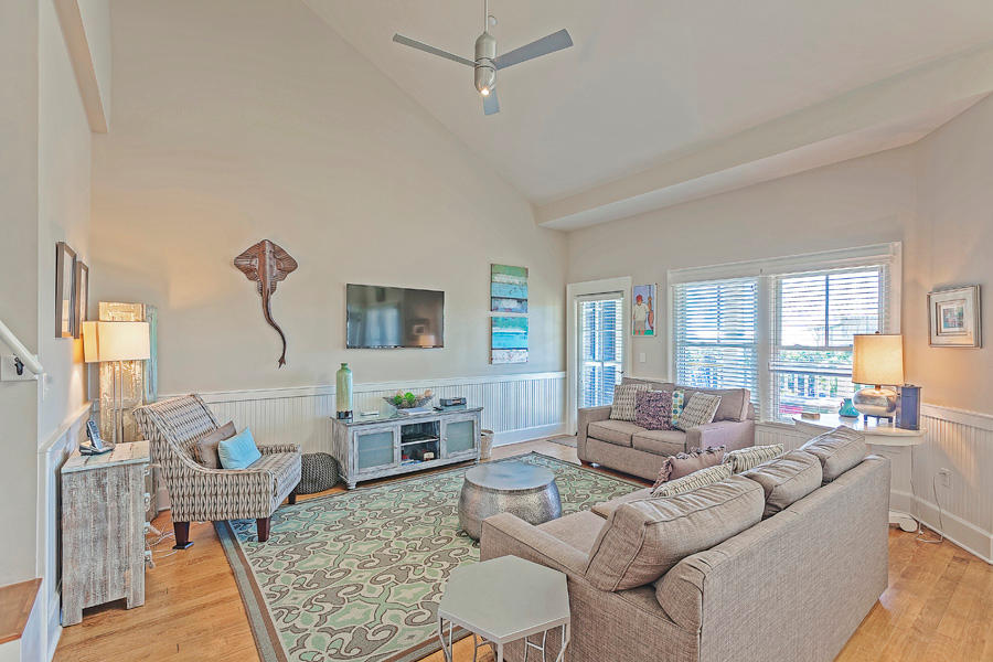 Located in the Watercolor Town Center, this updated one bedroom with loft condominium is very spacious. The main level features living and dining areas that open onto the covered porch, and a gourmet kitchen with breakfast bar. The comfortable master suite also opens onto the covered porch. The second level loft sleeps three and is served by a full guest bath on the main level. The condo is a short walk to the Watercolor beach club, other watercolor amenities and Seaside. All dimensions are approximate and should be confirmed by the buyer.