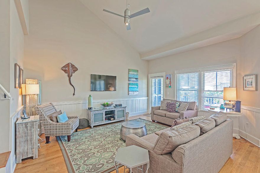 Located in the Watercolor Town Center, this updated one bedroom with loft condominium is very spacious. The main level features living and dining areas that open onto the covered porch, and a gourmet kitchen with breakfast bar. The comfortable master suite also opens onto the covered porch. The second level loft sleeps three and is served by a full guest bath on the main level. The condo is a short walk to the Watercolor beach club, other watercolor amenities and Seaside. All dimensions are approximate and should be confirmed by the buyer.