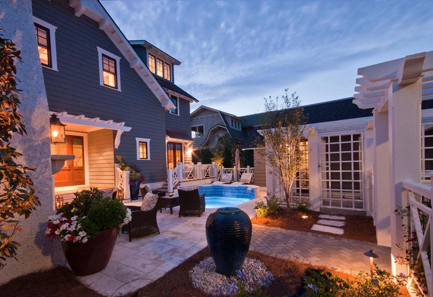 This spectacular custom home is all about gulf and lake views. Nestled in the exclusive, private, gated WaterSound Beach Community it sits on the shore of Camp Creek Lake. (A rare coastal dune lake.) Enjoy the peace and tranquility of the Peninsula, the most private section of WaterSound. Look out over the lake to the beautiful white dunes and the turquoise waters of the Gulf of Mexico. Stroll over boardwalks and pedestrian bridges to the beach and community pool. On your way you may see a Great Blue Heron, Osprey or Bald Eagle. As you enter the property, you are greeted by a casual entertaining area that has a lovely pool/spa, a wood burning fireplace and built in TV with hidden speakers. The home was designed by TS Adams and expertly built by Gulfview Construction with great attention