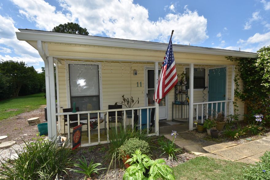 Ideal for your beach getaway or add to your investment portfolio. One-story townhome located less than 1/2 mile to a public beach with parking! This is a small townhome community, just 16 units. There is a community Pavilion and Laundry house. There is a porch on the front of the home with an outside storage closet.